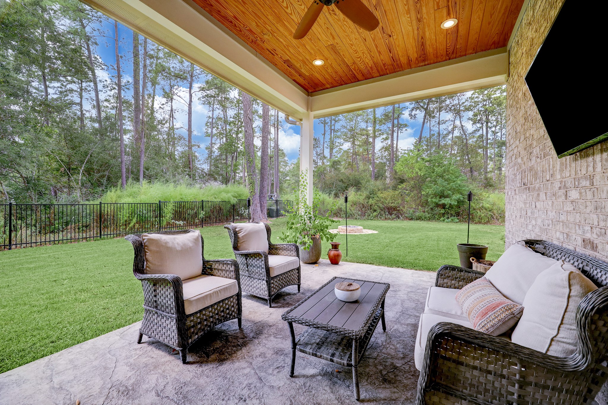 Outside, the expansive backyard is an oasis of tranquility, surrounded by the beauty of nature.
