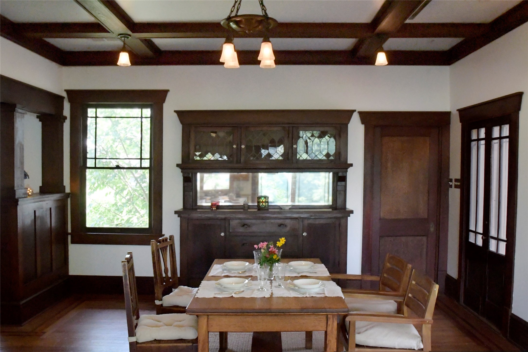 Dining room: Just as it was in 1913, featuring built-in china closet, coffered ceilings, and chandelier.