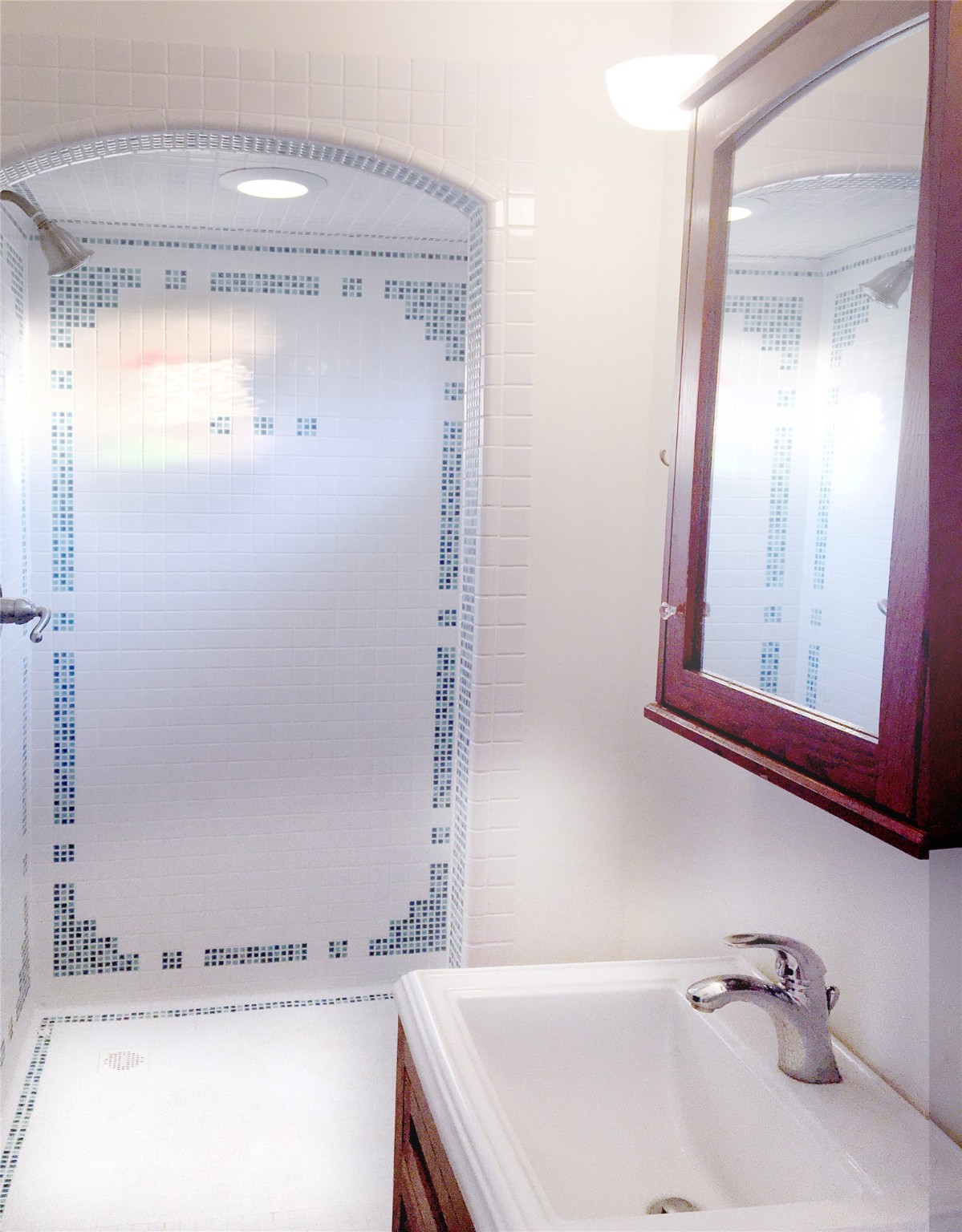 Shower with Craftsman inspired tile design.