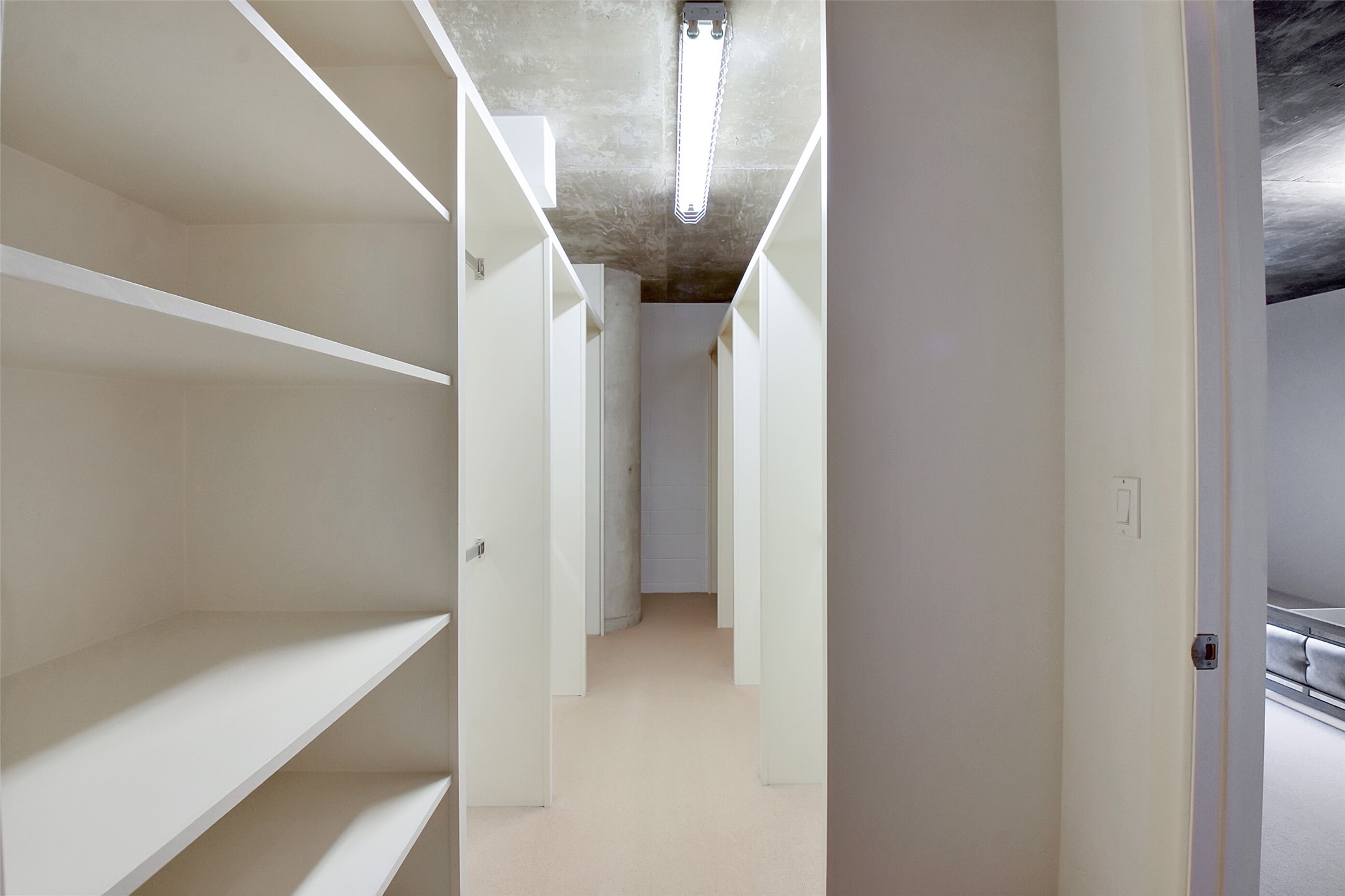 THIS ENORMOUS WALK-IN CLOSET INCLUDES DOUBLE RAILS AND PLENTY OF STORAGE SPACE.
