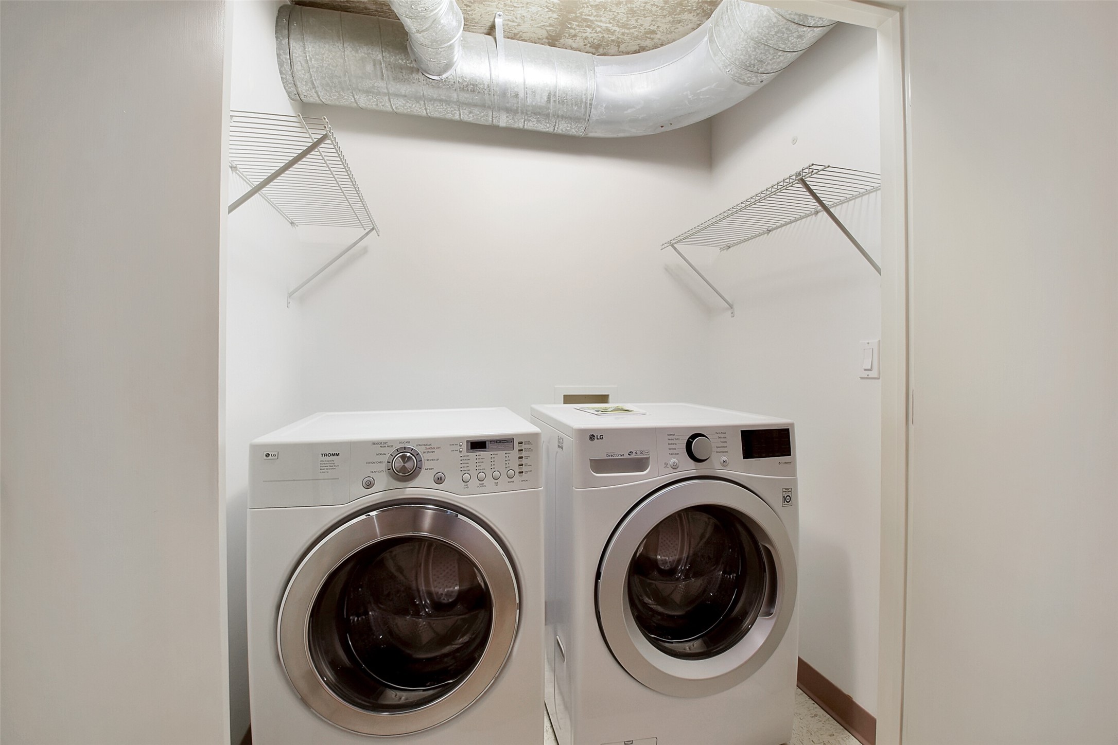 THE  UTILITY ROOM IS LOCATED ON THE SECOND FLOOR WITH USEFUL STORAGE SHELVES. BONUS THE WASHER AND DRYER ARE INCLUDED!