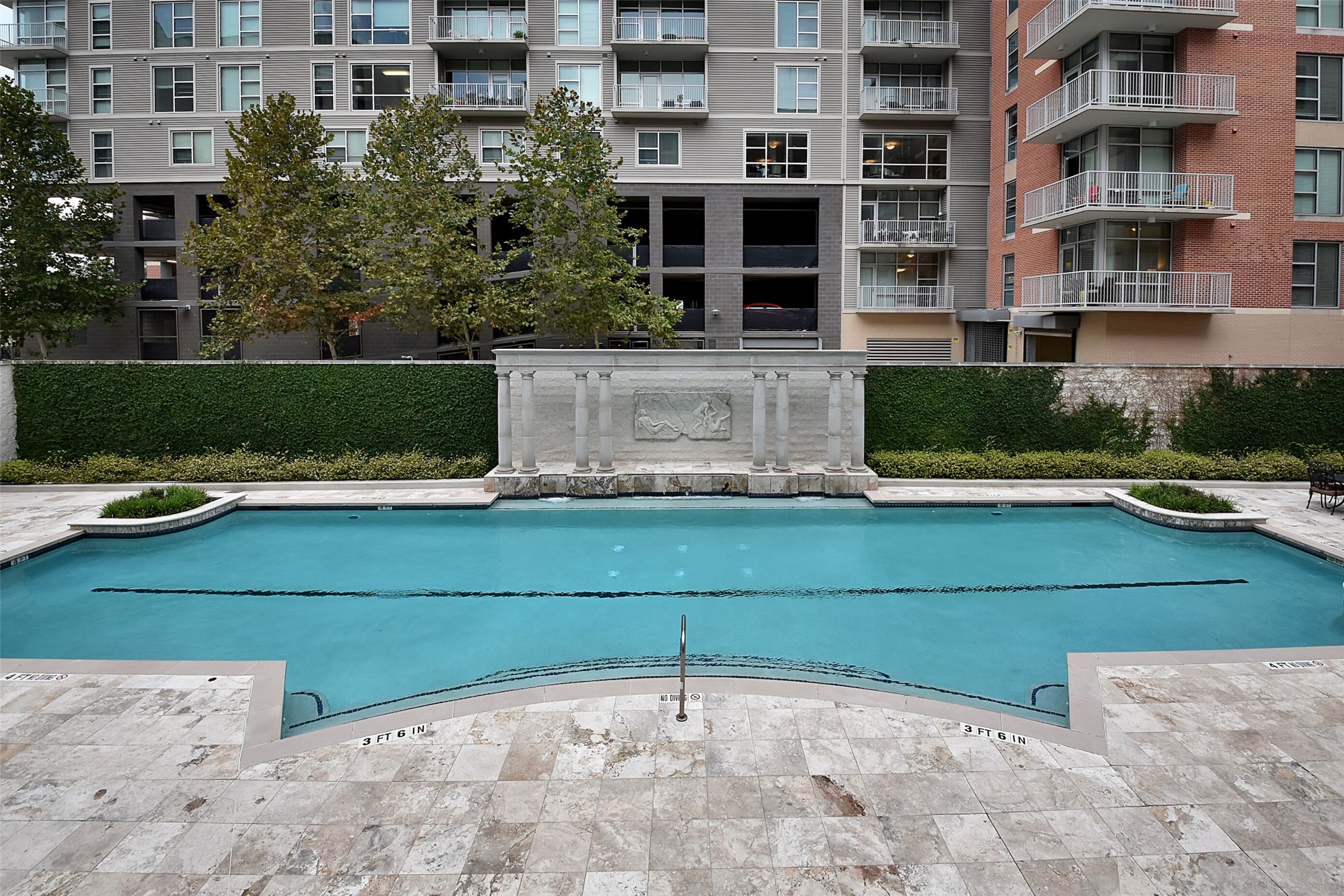 CONDO AMENITIES INCLUDE THIS RESORT STYLE-SWIMMING POOL