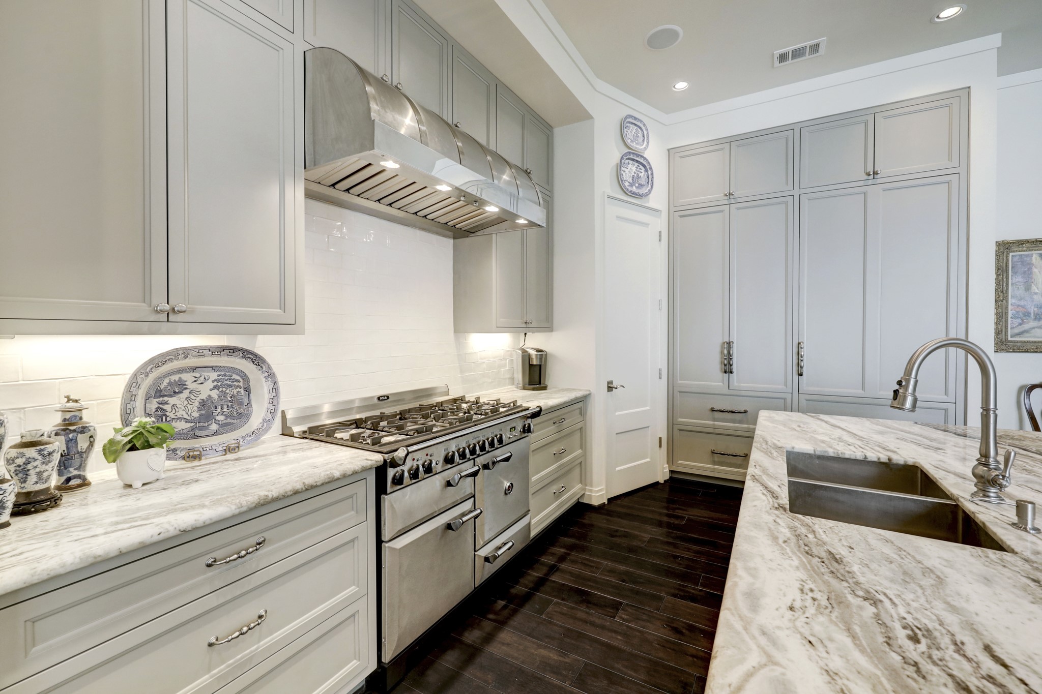 Alternate Kitchen view, cabinet front Sub Zero, upper/lower refrigerator and freezer.
