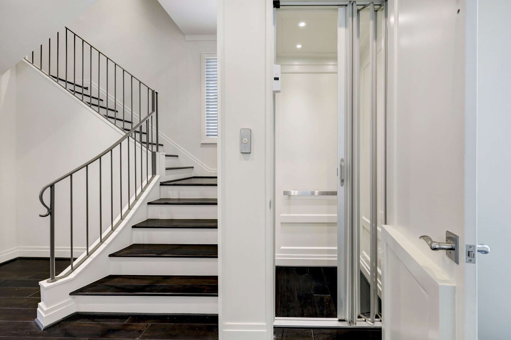 Elevator to all three levels and view of entry staircase.