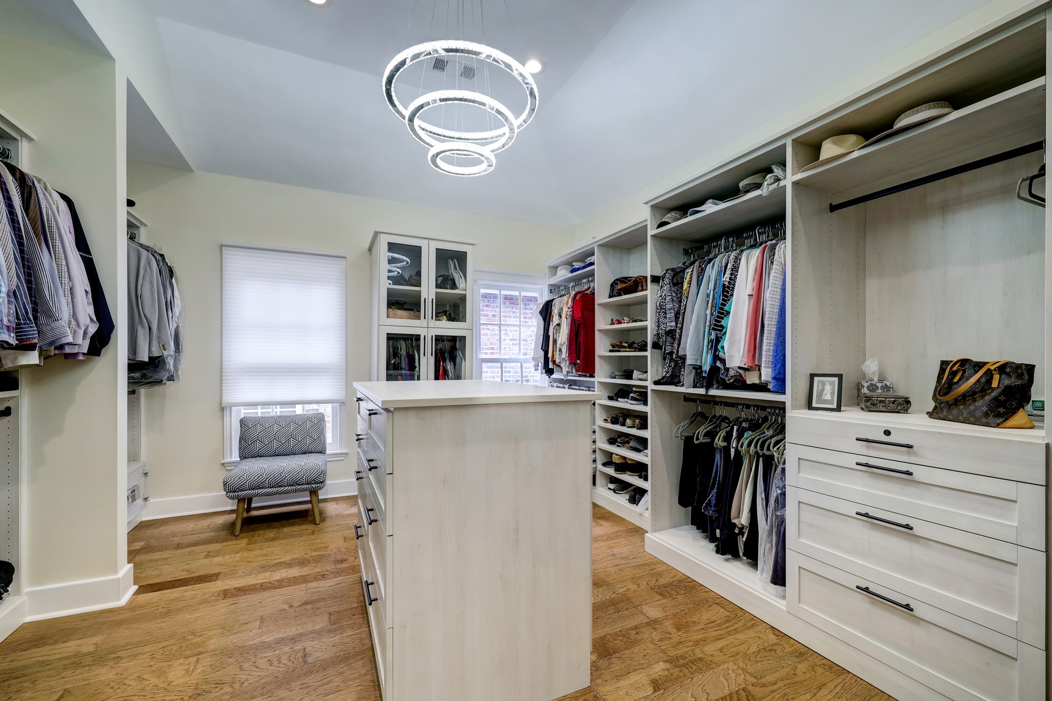 When the home was remodeled, the primary closet was expanded. Working with Container Store, the homeowners maximized every space.