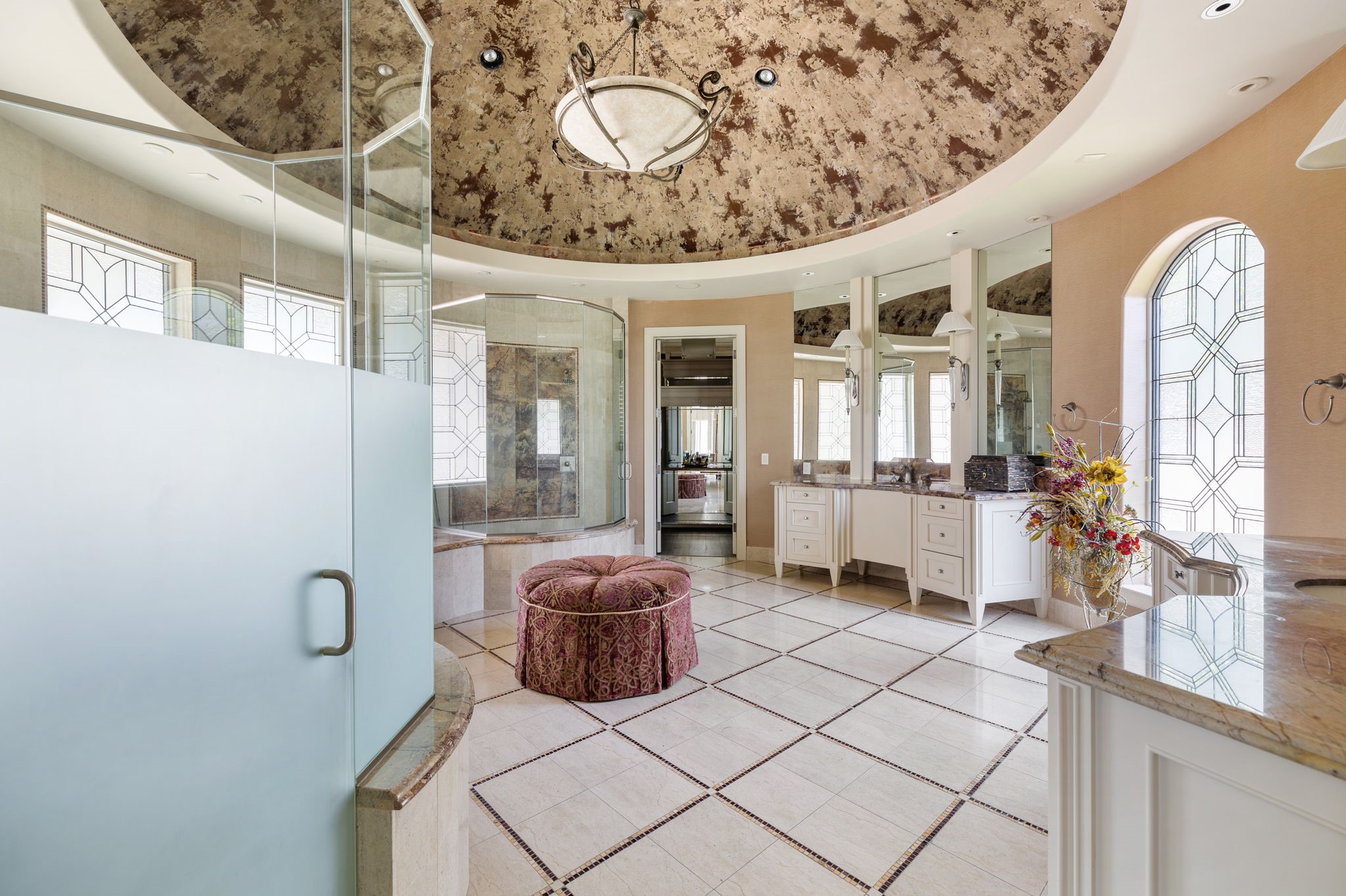 Good morning, Gorgeous!  Welcome to the Master Suite's Bathing Spa. The acoustics and flow of light are accentuated by dome ceiling with its illustrious faux finish.