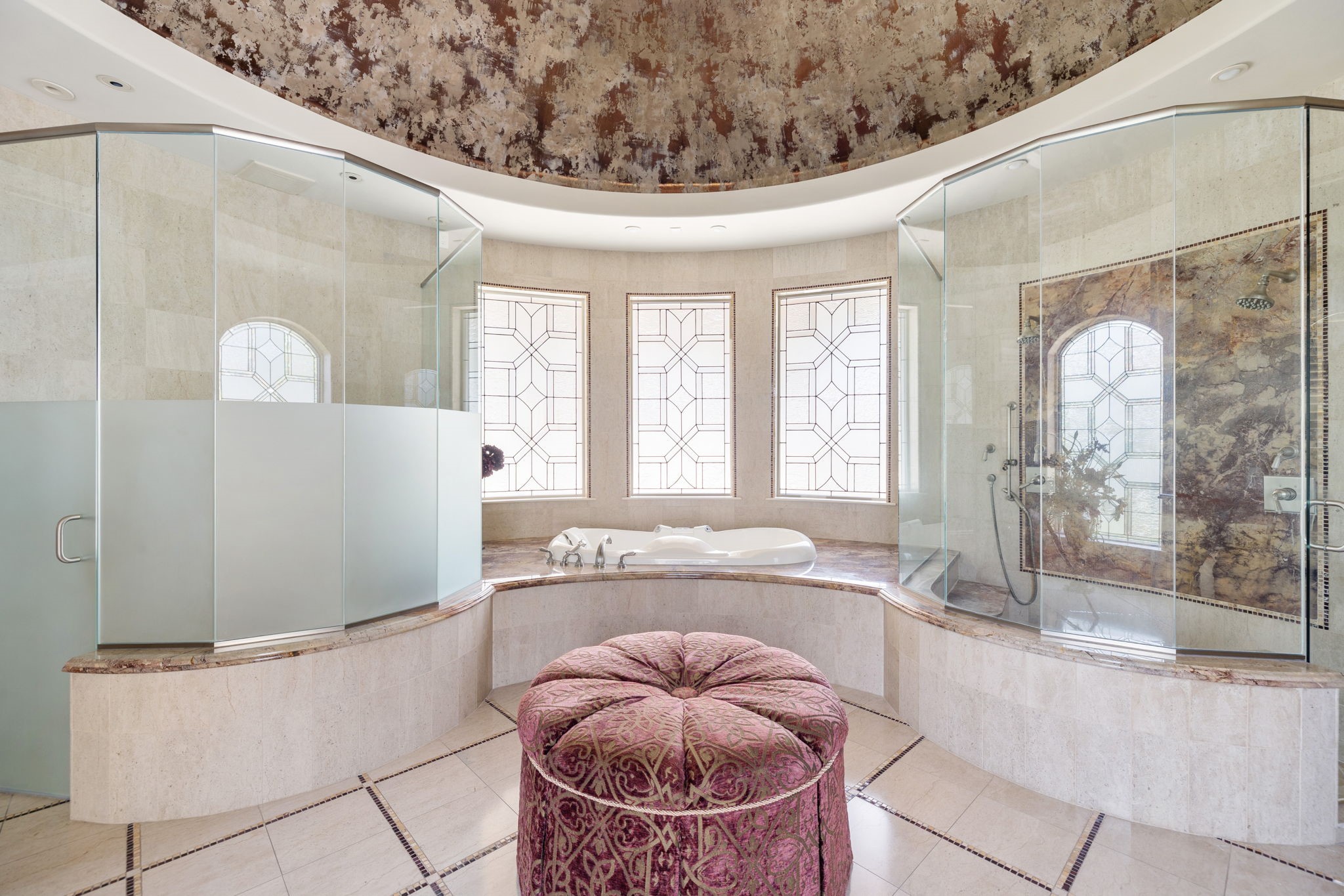The Master Bathing Spa features an oversized walk-in Shower with dual shower heads, and shower wand, a private Water Closet, dual Vanities and sinks, plus another series of leaded glass windows that afford privacy and light in the same space.
