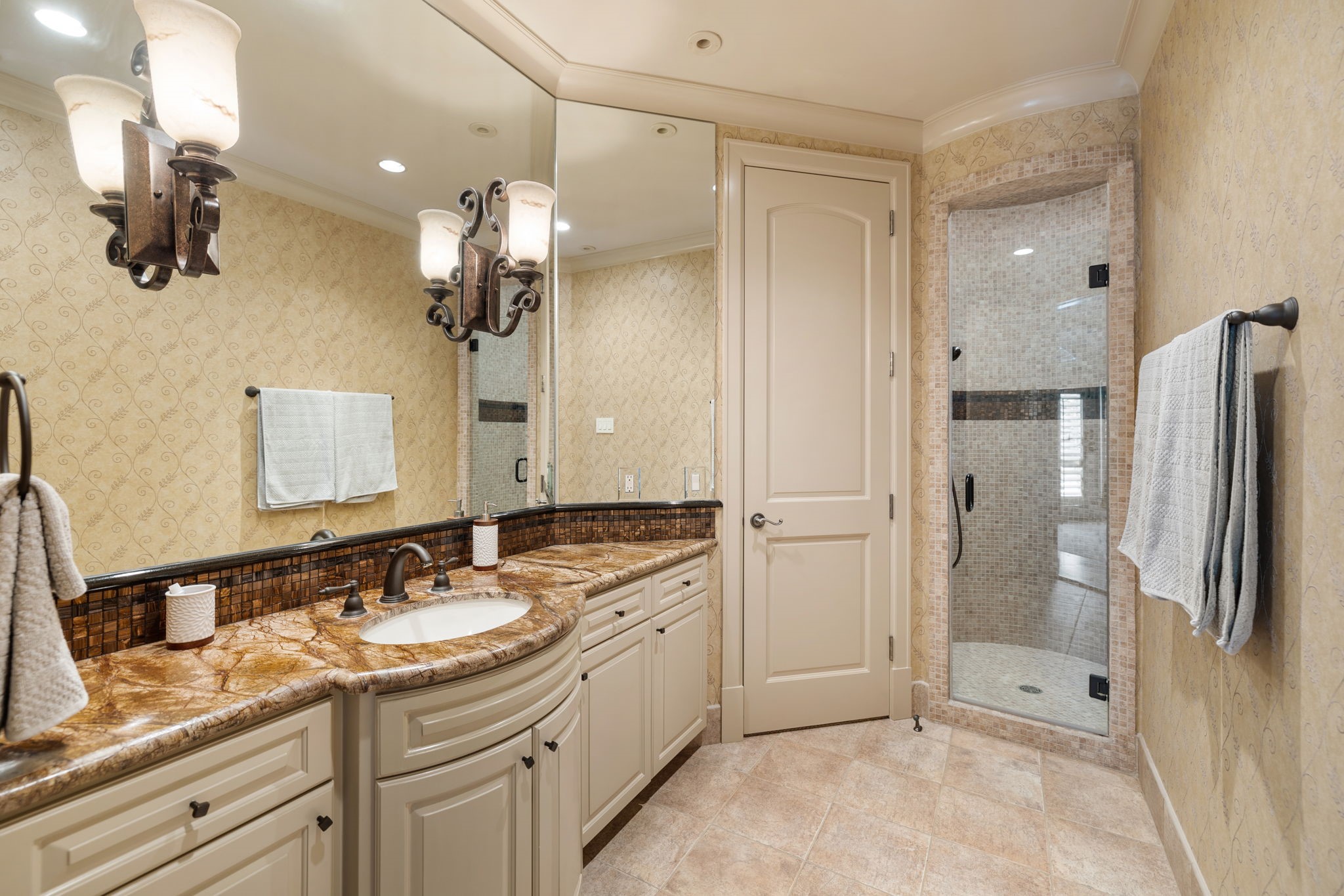 Every Bathroom in the home features custom cabinetry, captivating stone selections and tile selections for a unique look in each.