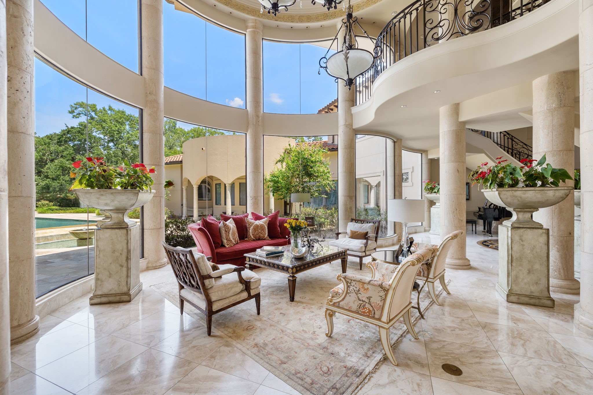 An grand setting with wonderful scale is the formal Living Room with views of the Back Yard and open to other of the public rooms.