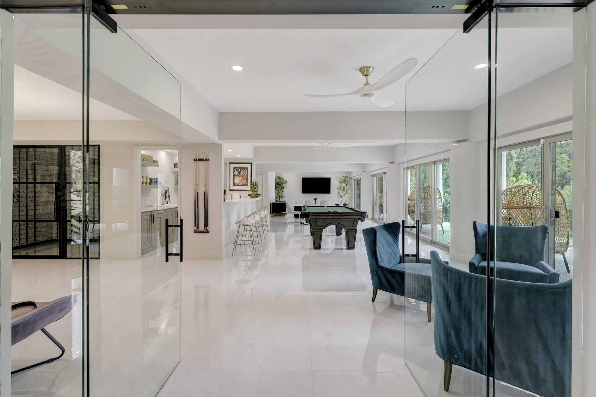 The oversized Formal Entry opens to the light & bright entertainment areas. With 2021 glass doors, this is the perfect space for holiday gatherings, art shows, and/or fundraisers,
