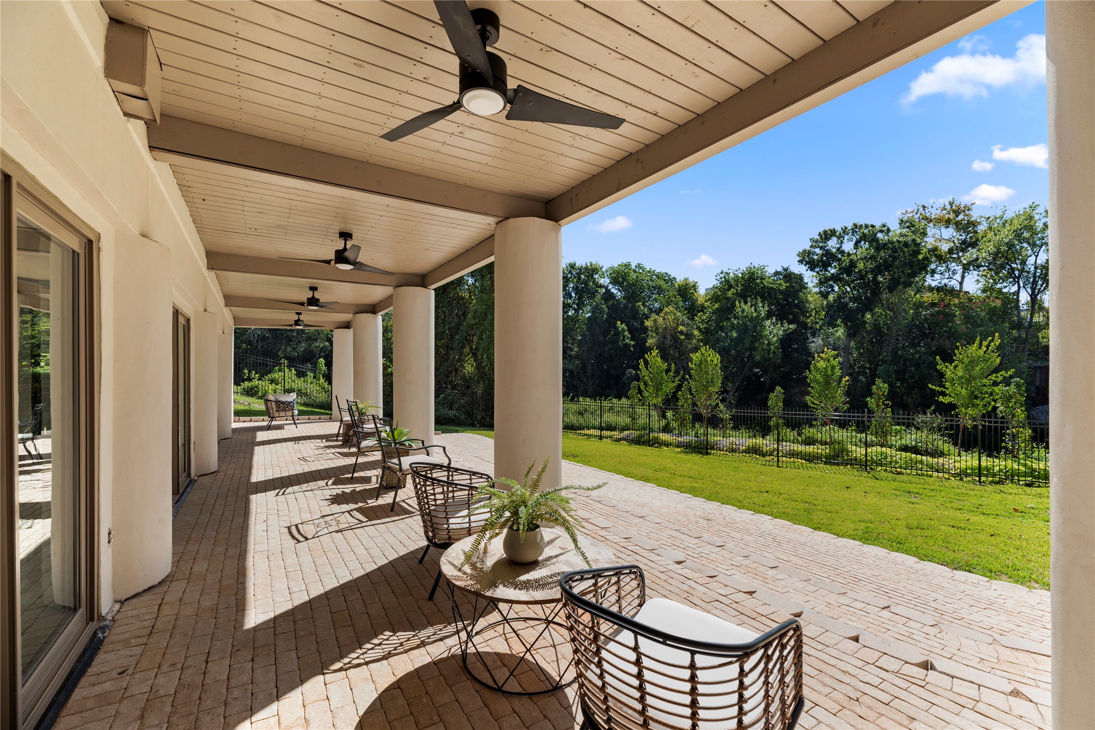 Relaxi this fall season on the  covered patio with ceiling fans & brick pavers. Cigar party anyone?