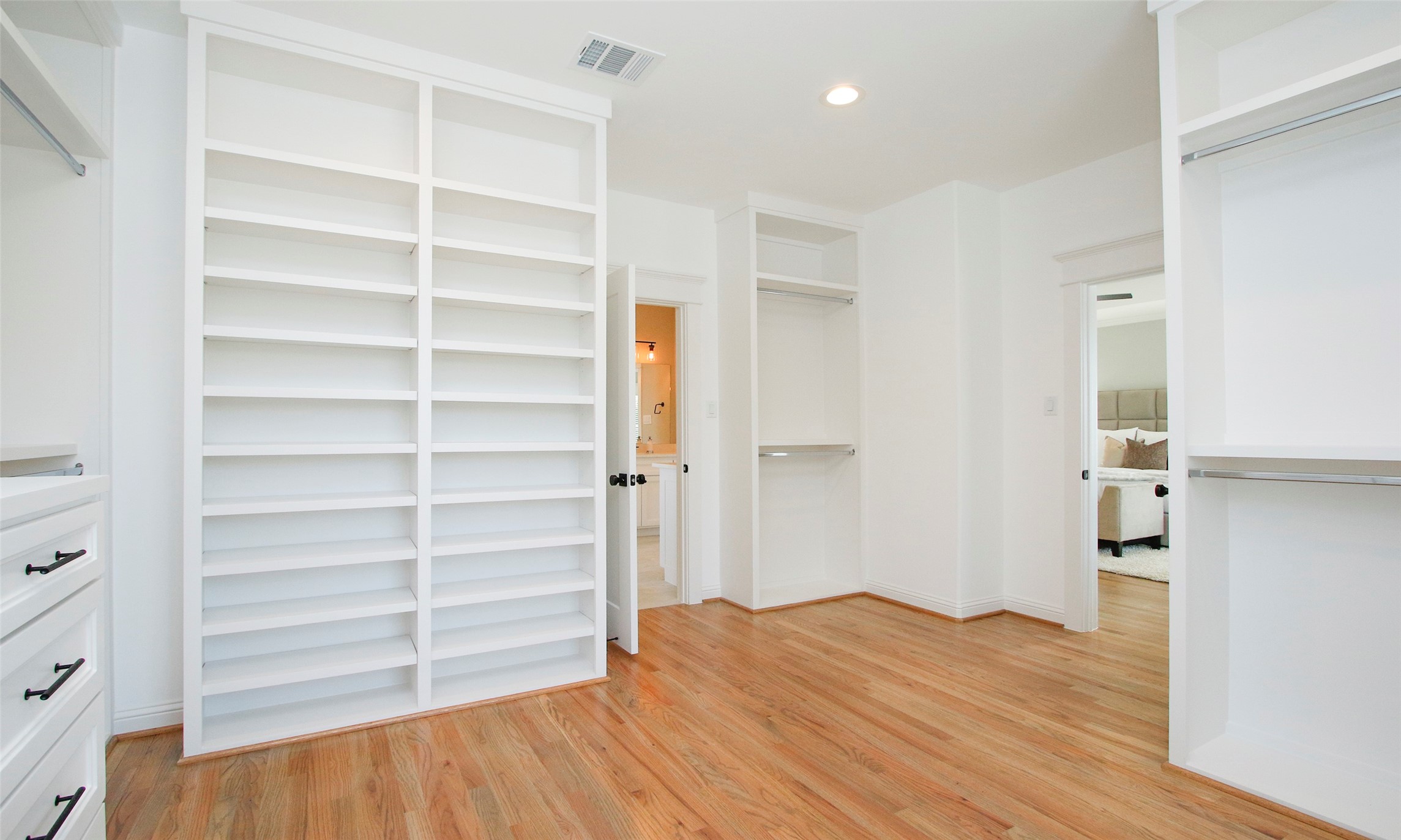 Primary Closet---TONS OF STORAGE and natural light
