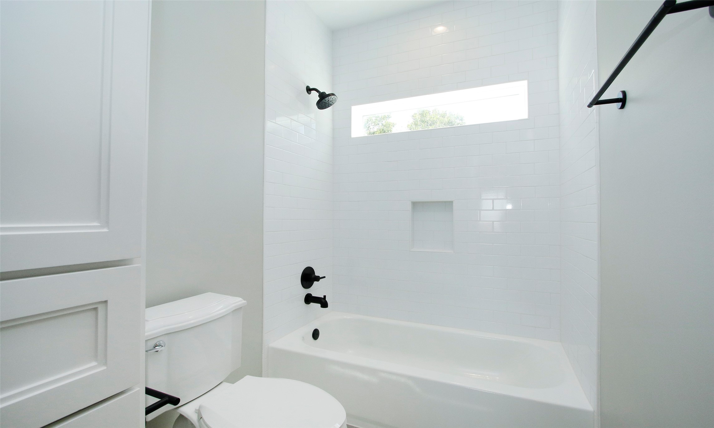 Secondary Bath--Beautiful Shower with Full-Height Vanity and Hamper