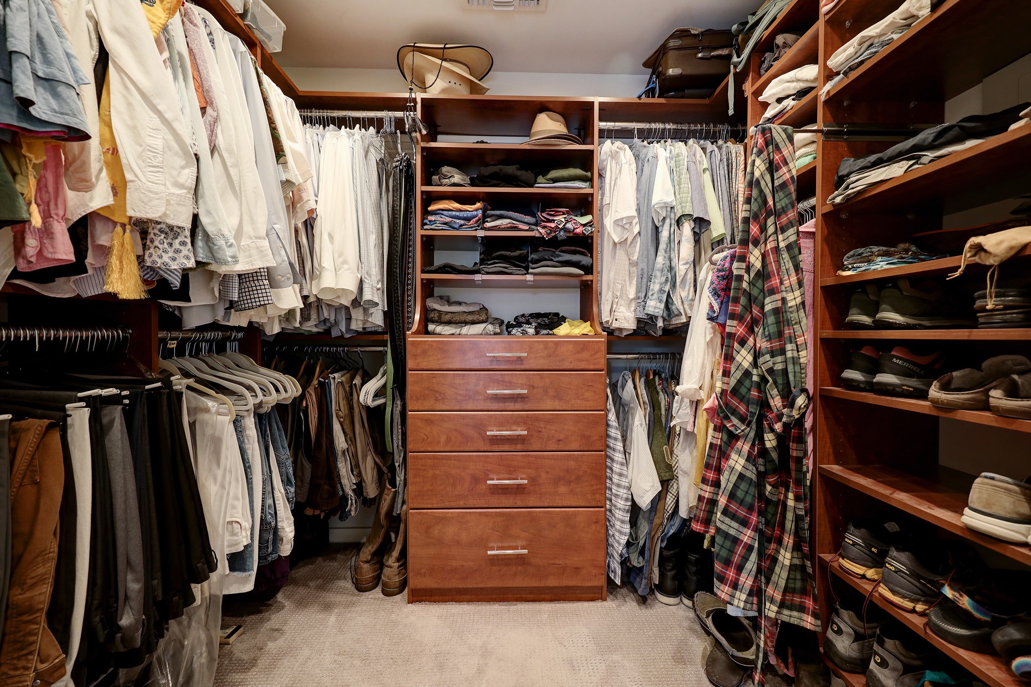 The custom built-ins in the large primary closet maximize the storage.