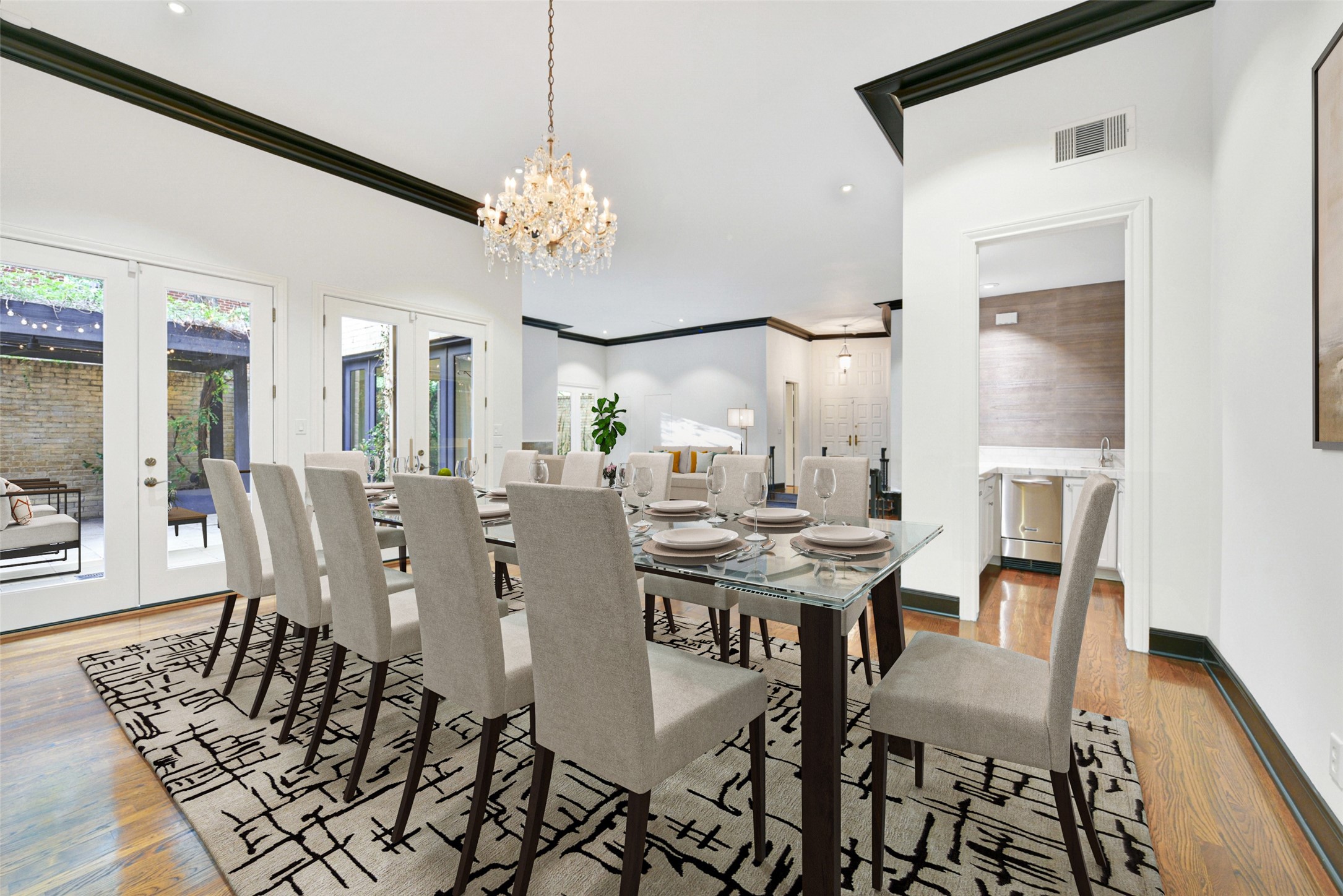The formal dining room is perfect for large dinner gatherings and entertaining. The adjacent wet bar opens to the living room offering versatile serving options.