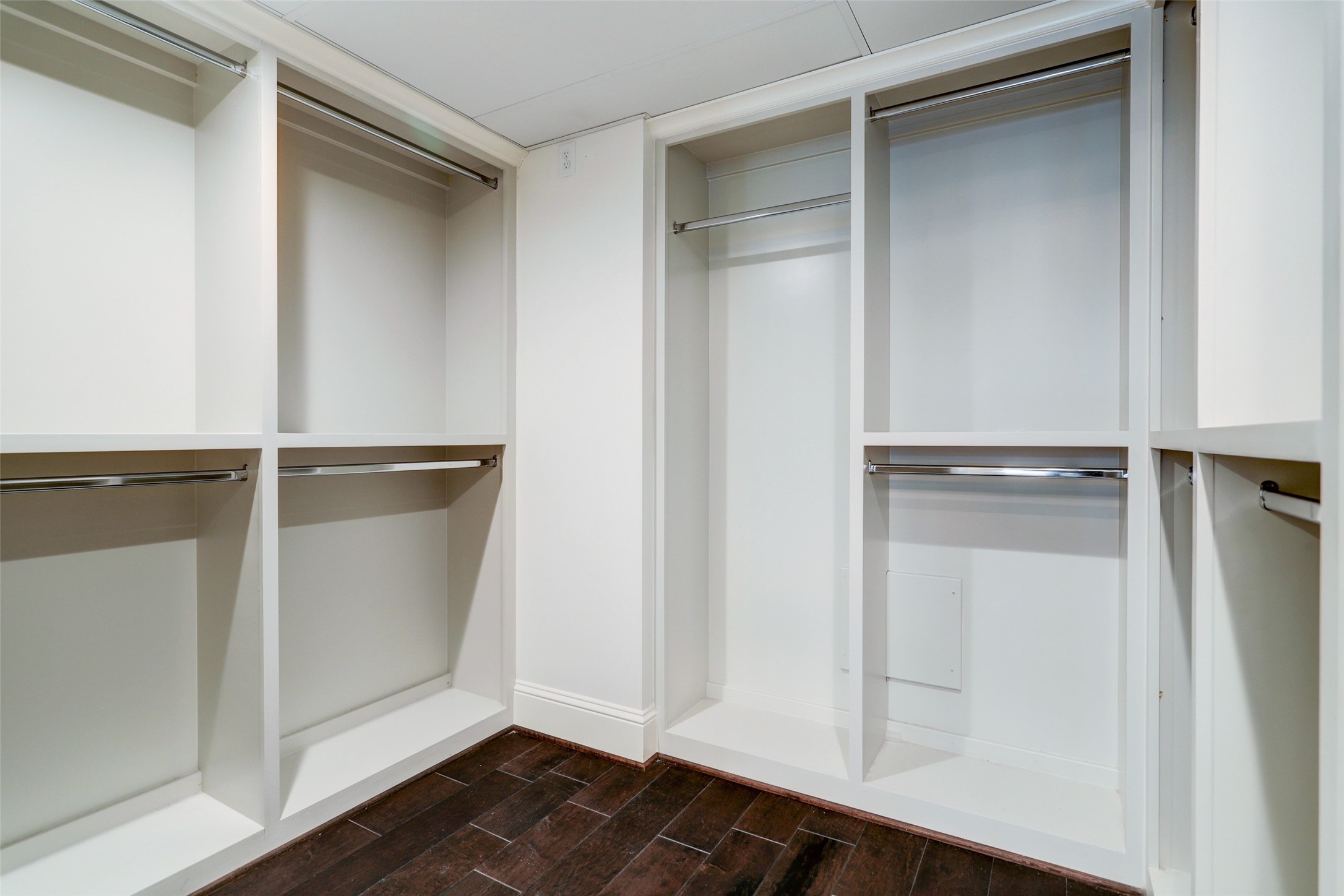 Here is the primary custom closet with plenty of hanging and built-in storage.