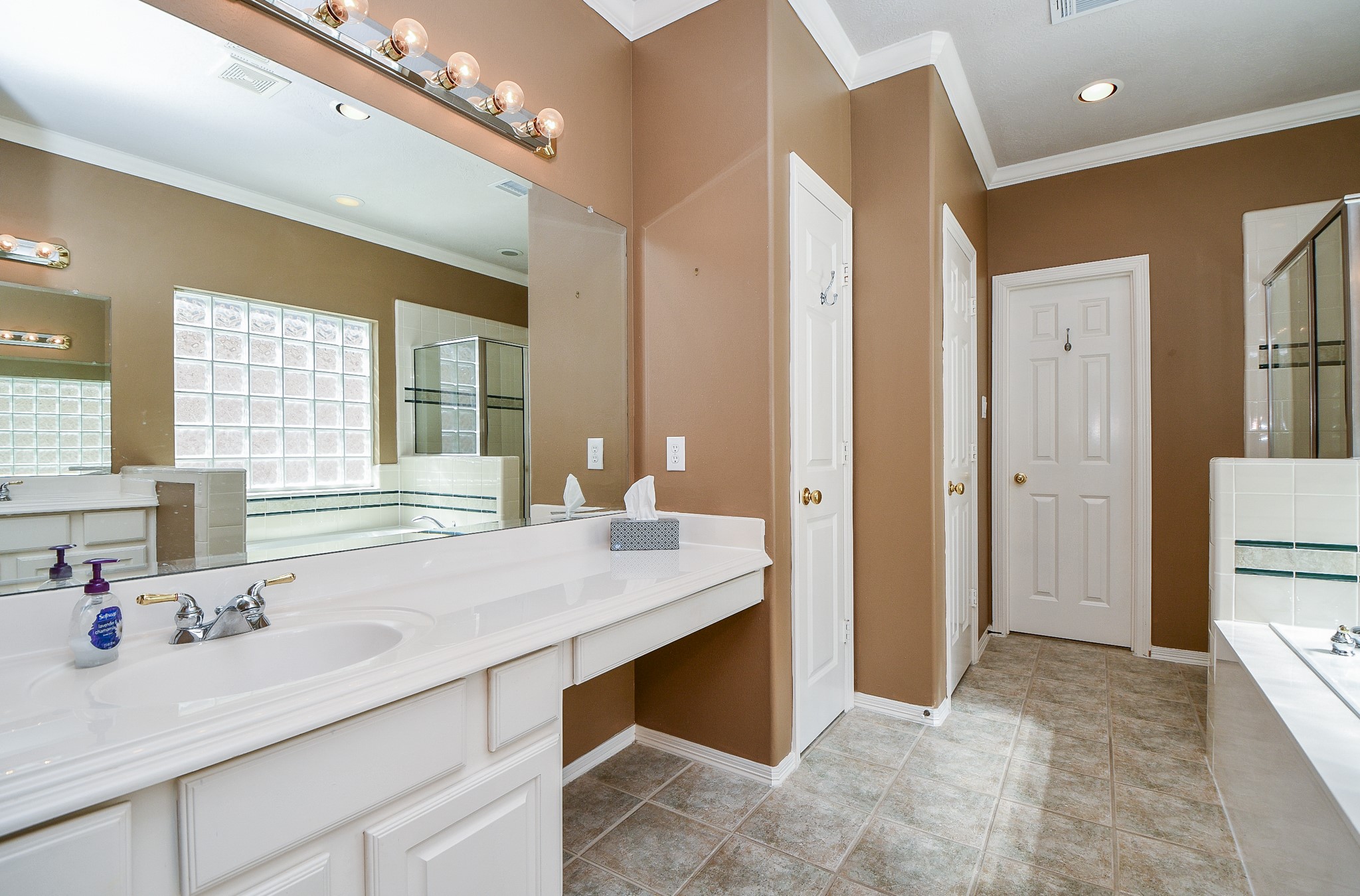 Another view of the Master Bath with double sinks, Makeup Vanity and Linen Closet