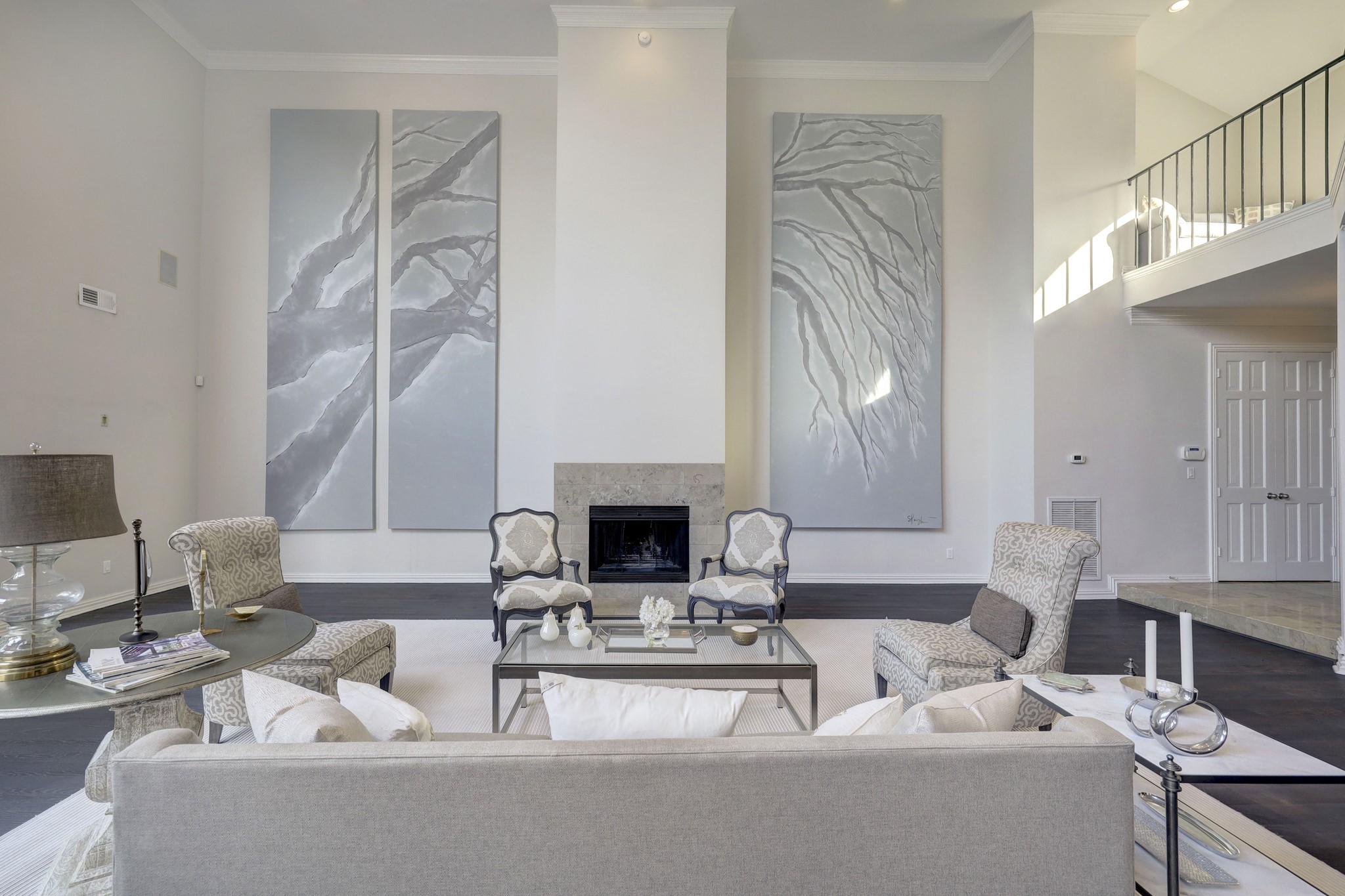 The stunning artwork on both sides of the fireplace will convey with the sale of the home.