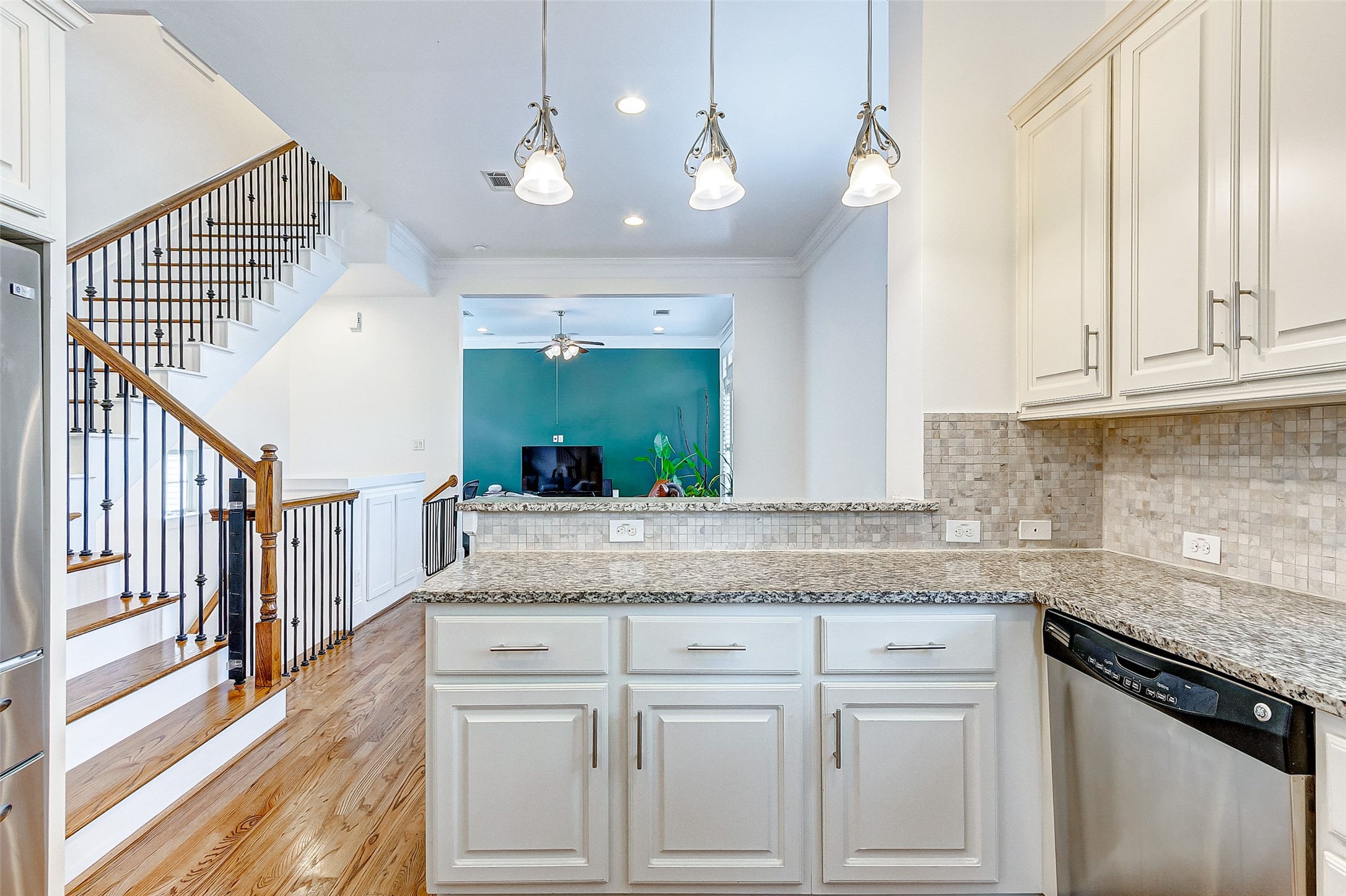 Your new kitchen boasts a granite breakfast bar open to the elegant formal dining room with views of your family room.