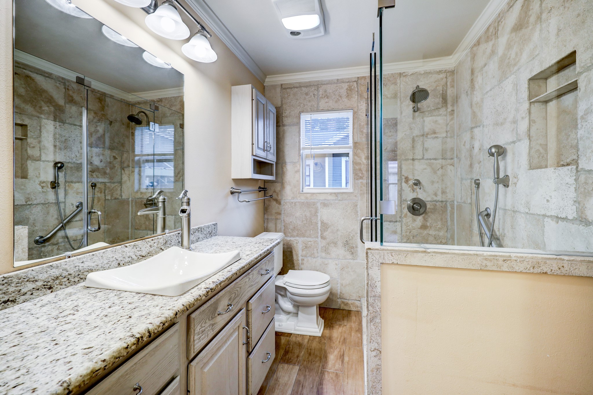 BATHROOM- bath features walk in shower and room for double sinks.