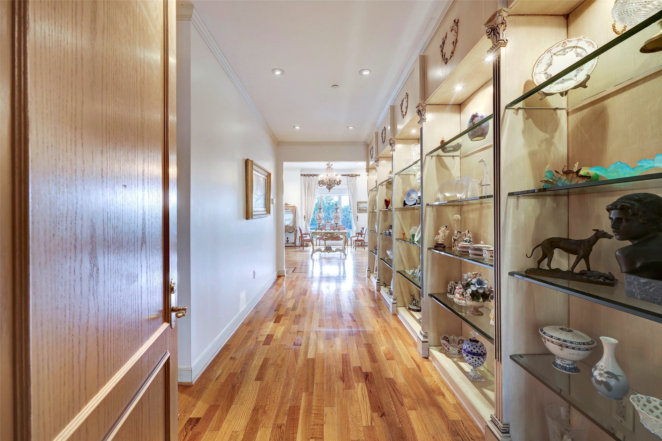 Upon entering, the right wall is a lighted display case with glass shelves.
