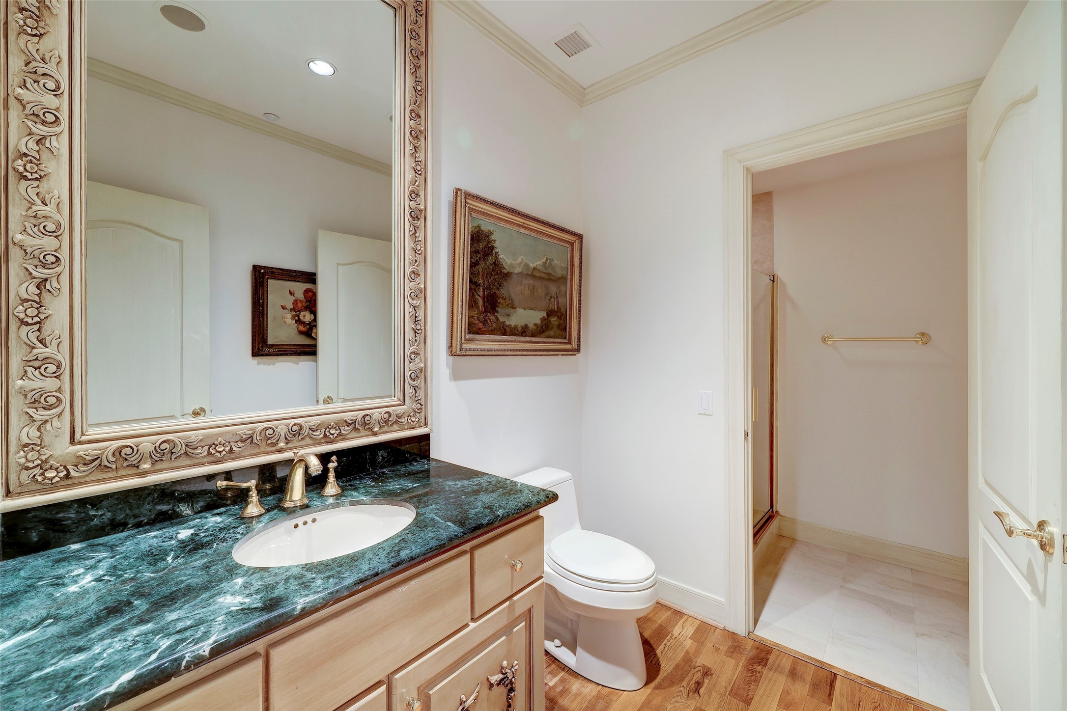 A full second bathroom with marble counters and stand up shower.
