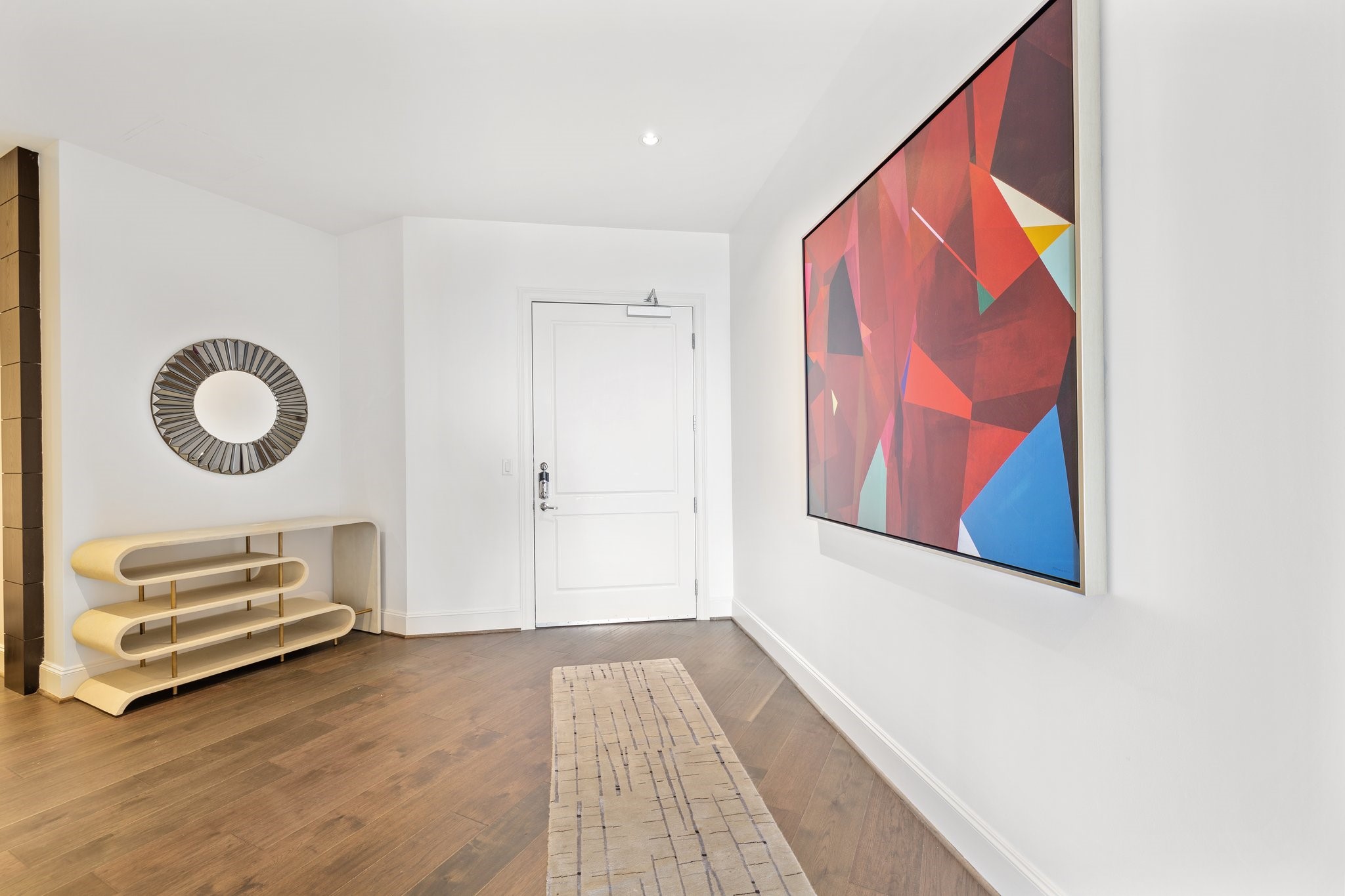 New wood floors span the entire condo, providing a chic contrast to the luminous space and offering a warm welcome to your residence.