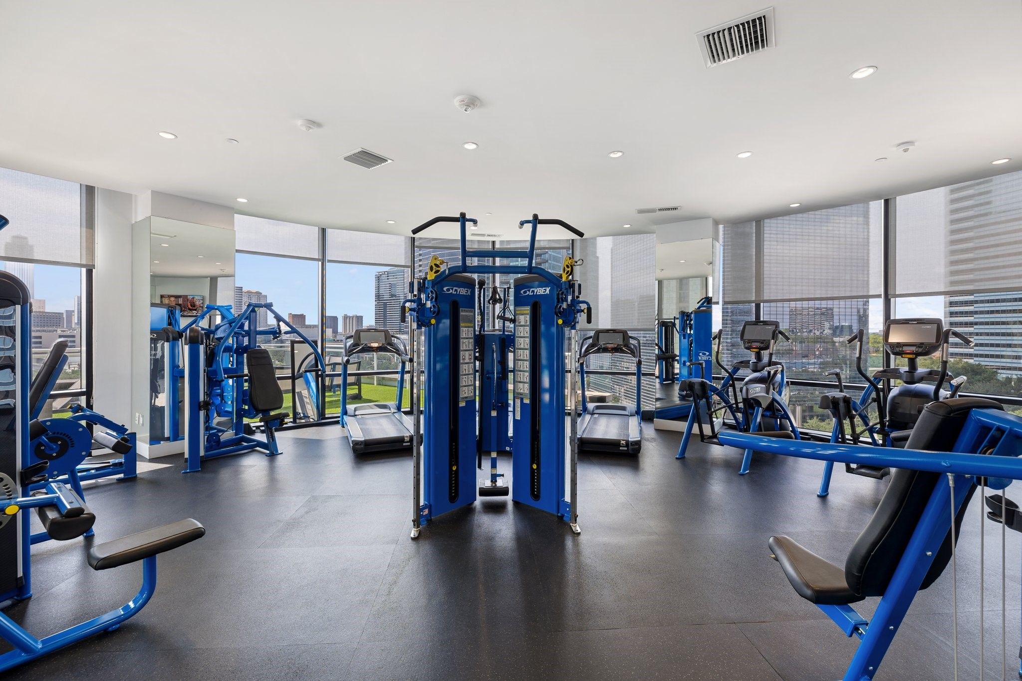 This state-of-the-art gym boasts not only top-tier fitness equipment but also expansive windows that provide a breathtaking view of Uptown Houston's skyline. The generous infusion of natural light creates an energizing ambiance, perfect for a motivating workout. The juxtaposition of sleek, modern gym equipment against the backdrop of the city's architectural marvels offers a unique workout experience. Whether you're running on the treadmill or lifting weights, the view ensures your workouts are both