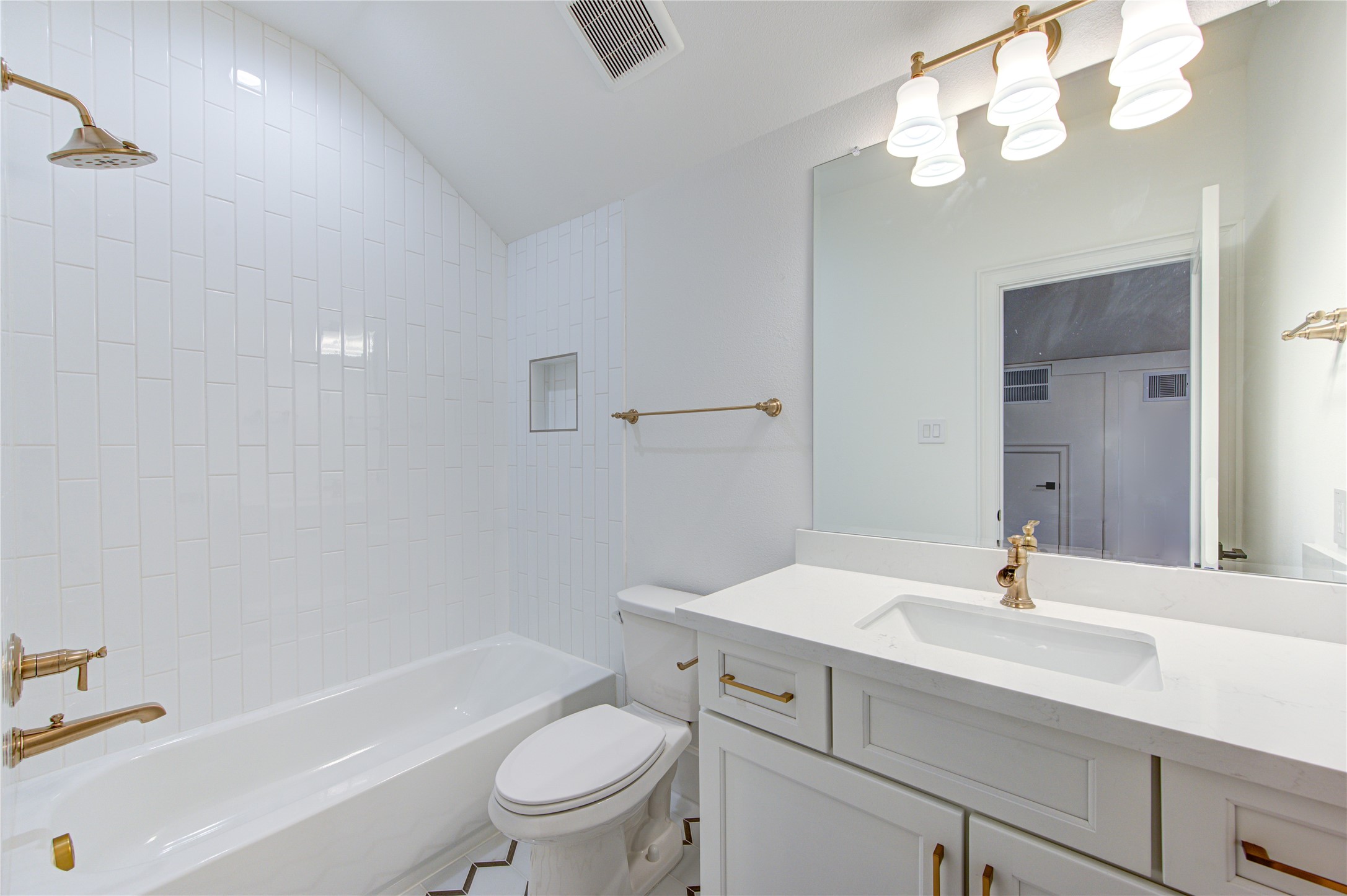 The third floor bathroom features the French Oak wood cabinets with tub/shower--4 full bathrooms in this home!