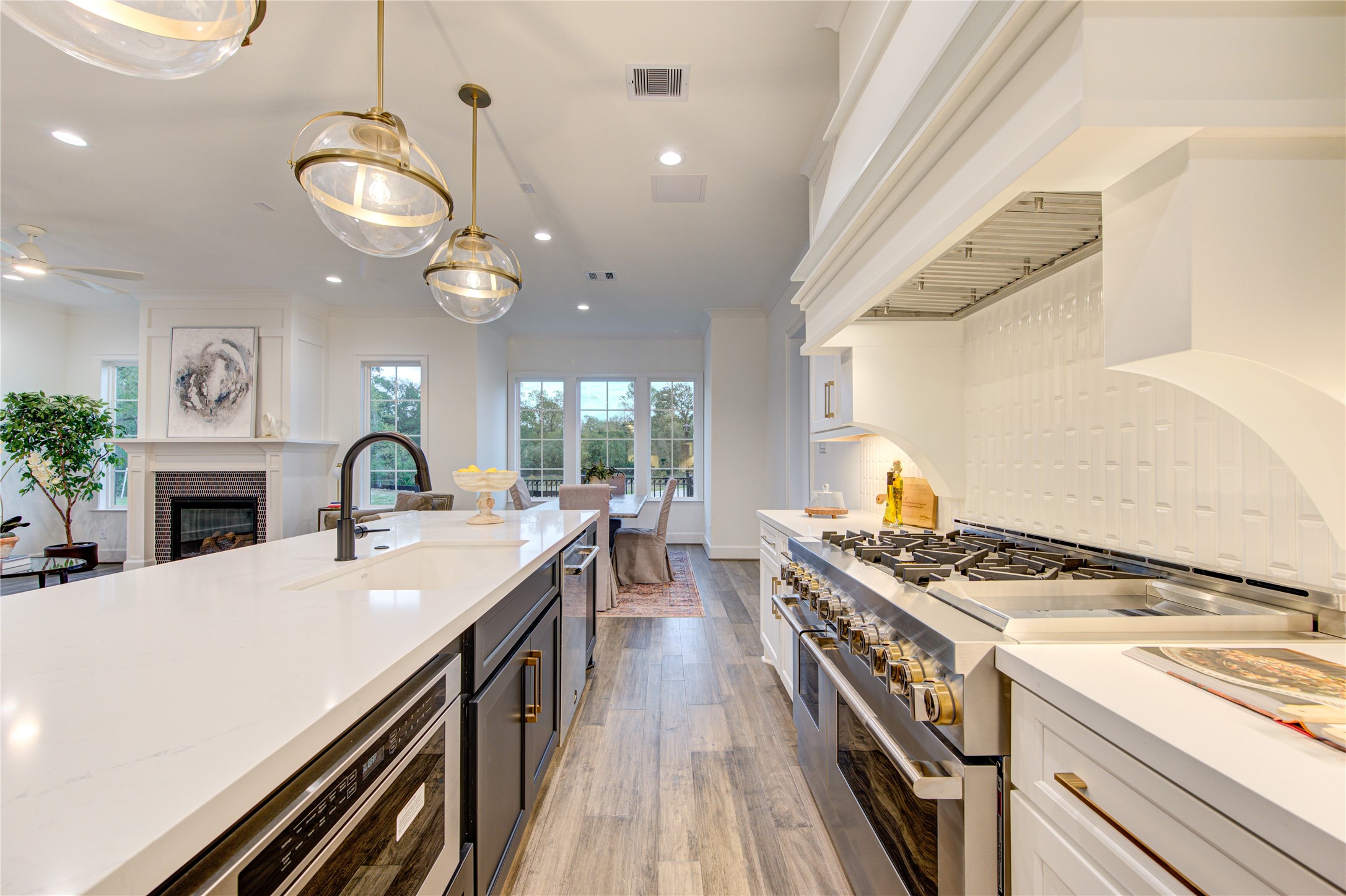 The kitchen is a culinary delight with professional series appliances, including a six burner as range and tons of Quartz counters for preparing meals and entertaining.