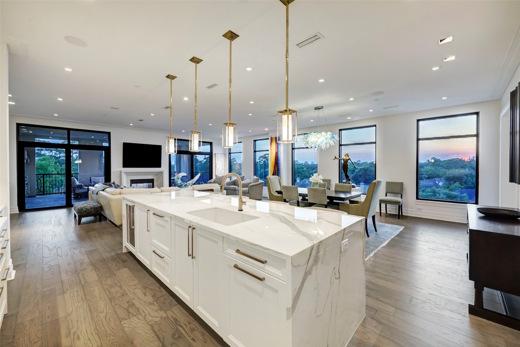 The Island highlights include a Fisher + Paykel double drawer Dishwasher, SubZero Beverage Center, and oversized single compartment Sink.  At the end of the Island is a large trash drawer.