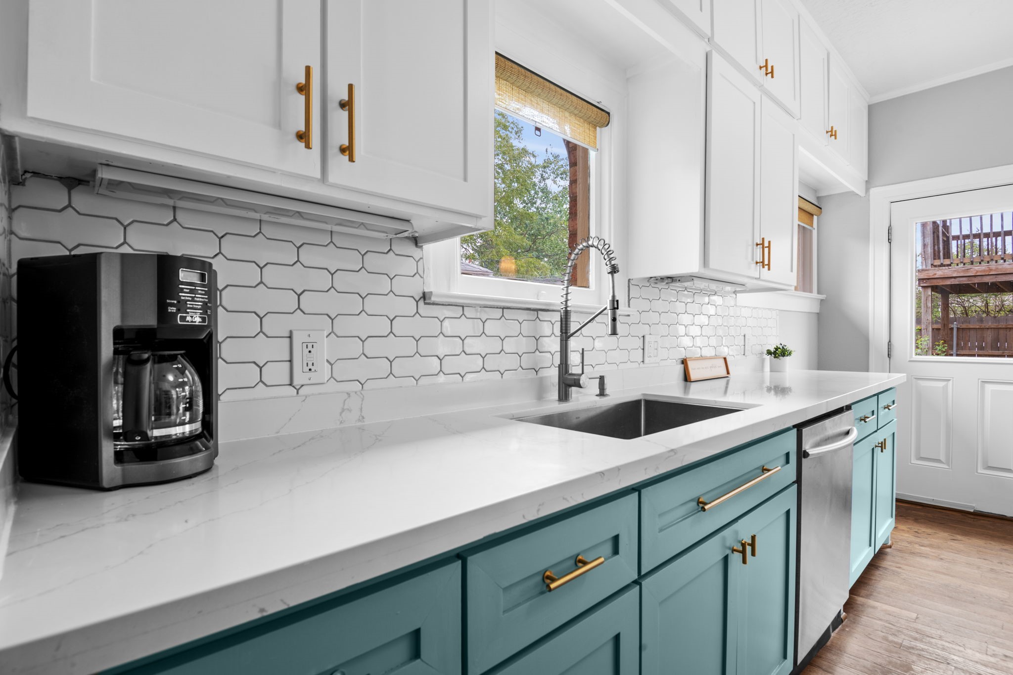 The current owners installed extra cabinets for storage, quartz countertops, backsplash, and appliances in the last few years!