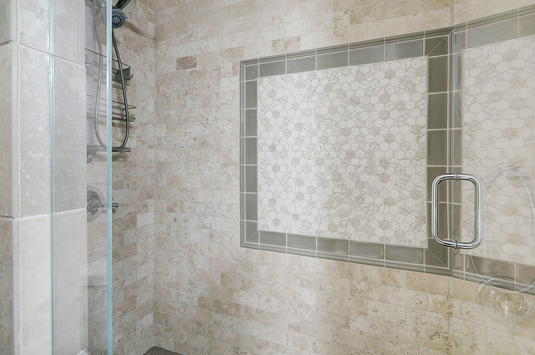 A large glass enclosed shower keeps the space light and airy.
