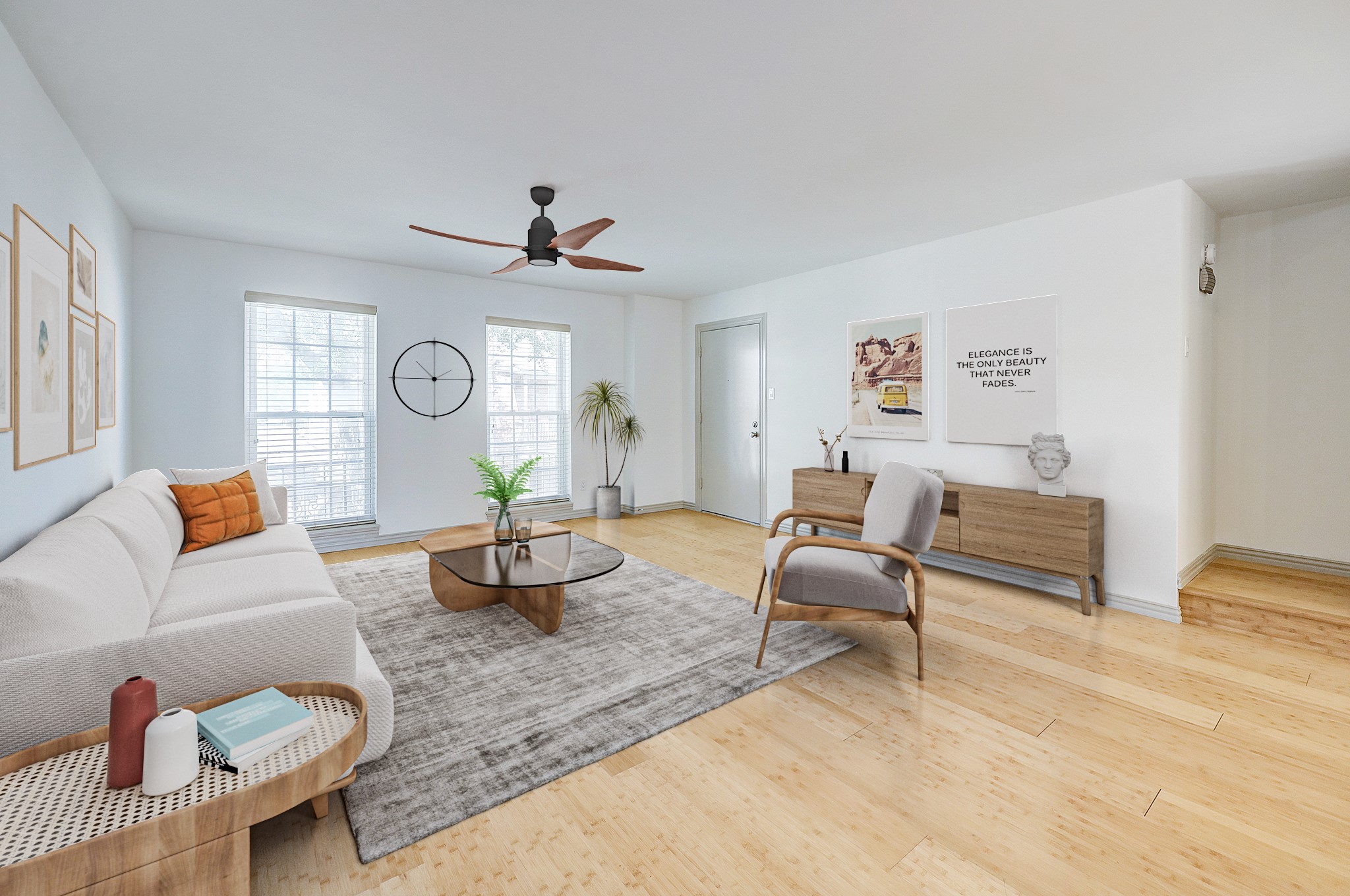 The large living room overlooks the community pool and invites natural light into the home. Wood-like flooring provides easy maintenance and runs throughout the home.
