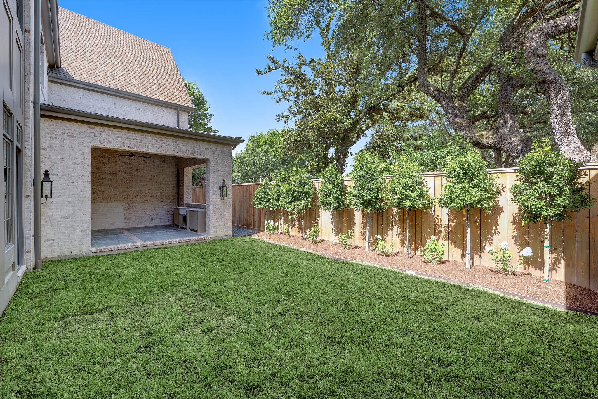 Lush landscaping awaits in the backyard, large enough to accommodate a 10'x20' pool if desired.