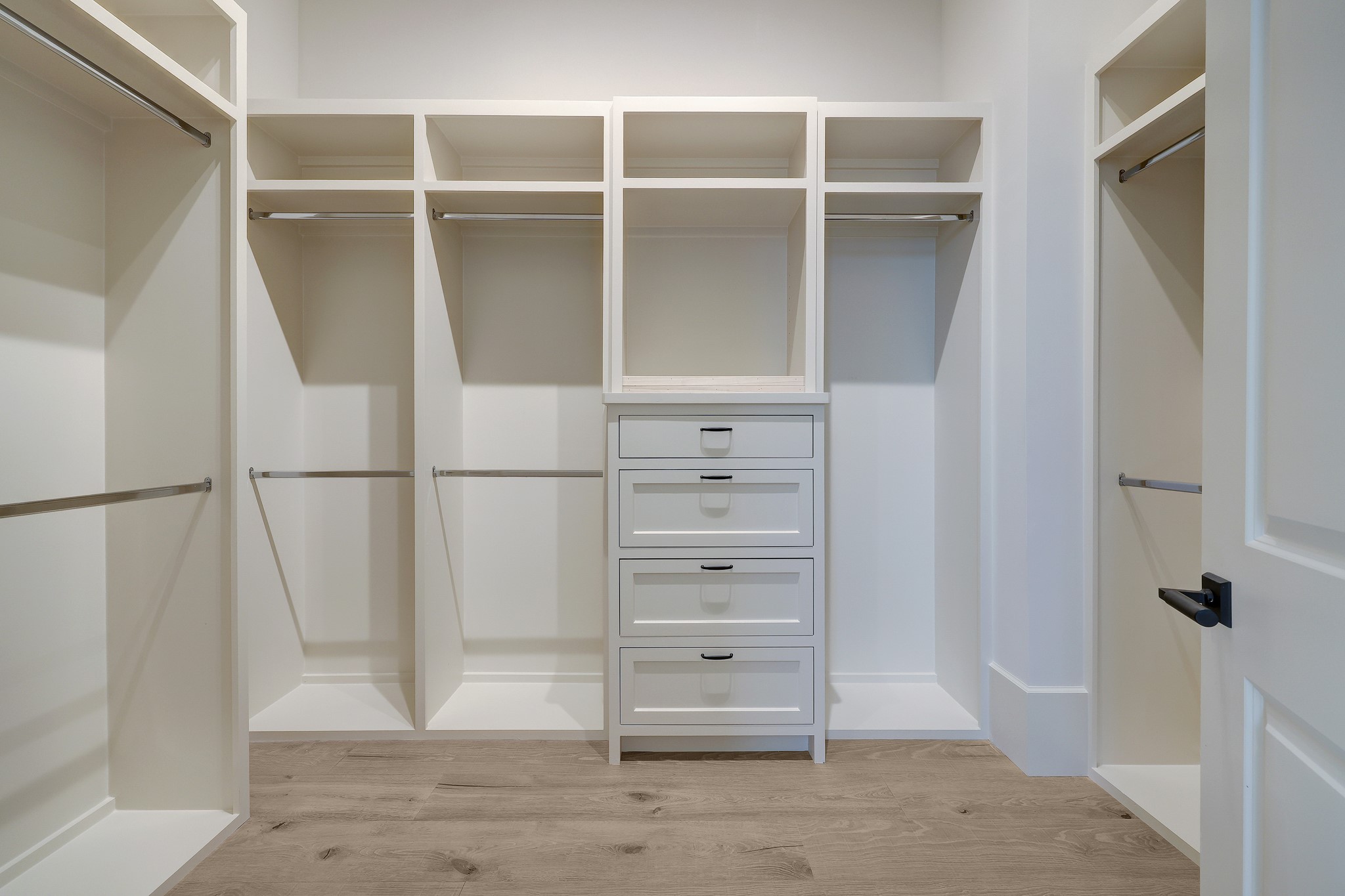 Custom fitted closet with abundant storage and built-ins.