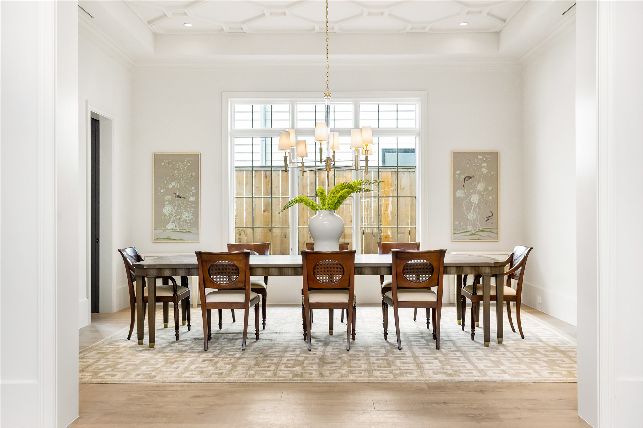 Fabulous dining room located just off the entry impresses with designer lighting and custom plaster moulding detailing on the ceiling. A stunning butler's pantry/bar area offers convenience while entertaining.