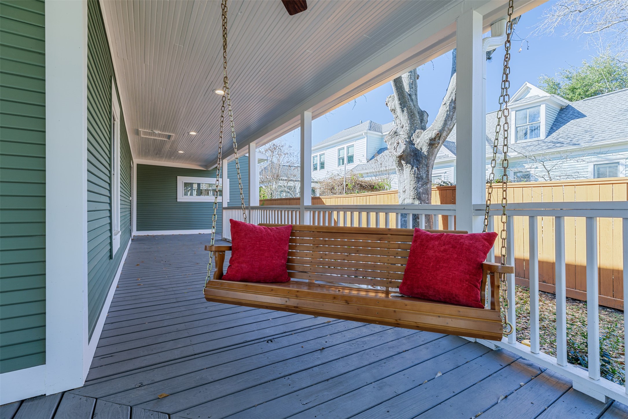 Relax under the fan to enjoy the full aspect of the period wrap around front porch.