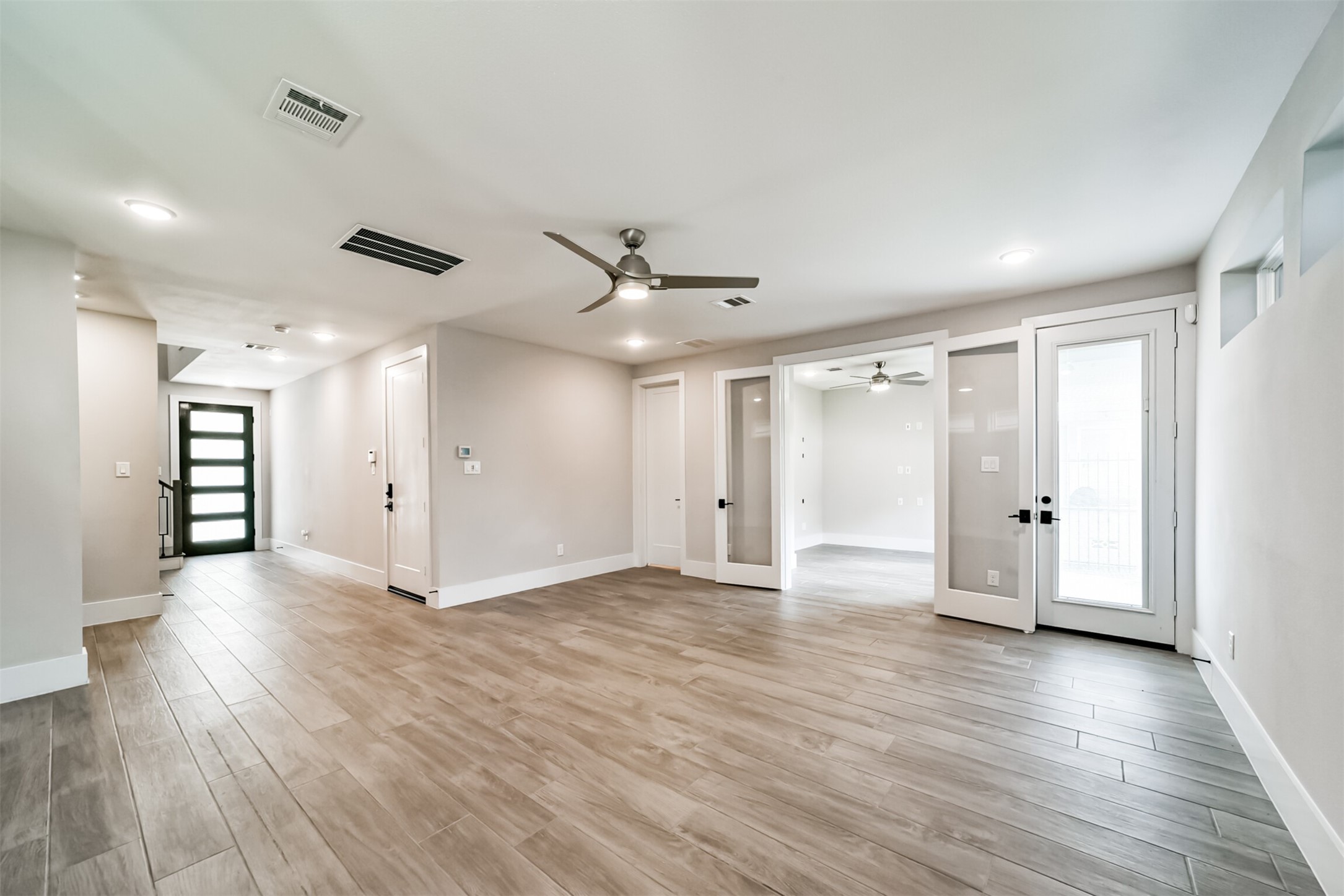 Incredible first floor game room/flex space with office and convenient half bathroom.
