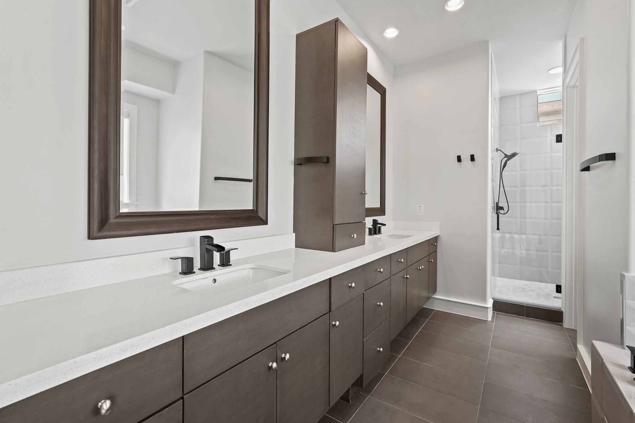 Dual Sinks & Large Wall Mirrors Adorn the Space allowing Morning / Nightly Rituals to be Relaxing & Luxurious. Featuring Ample Storage