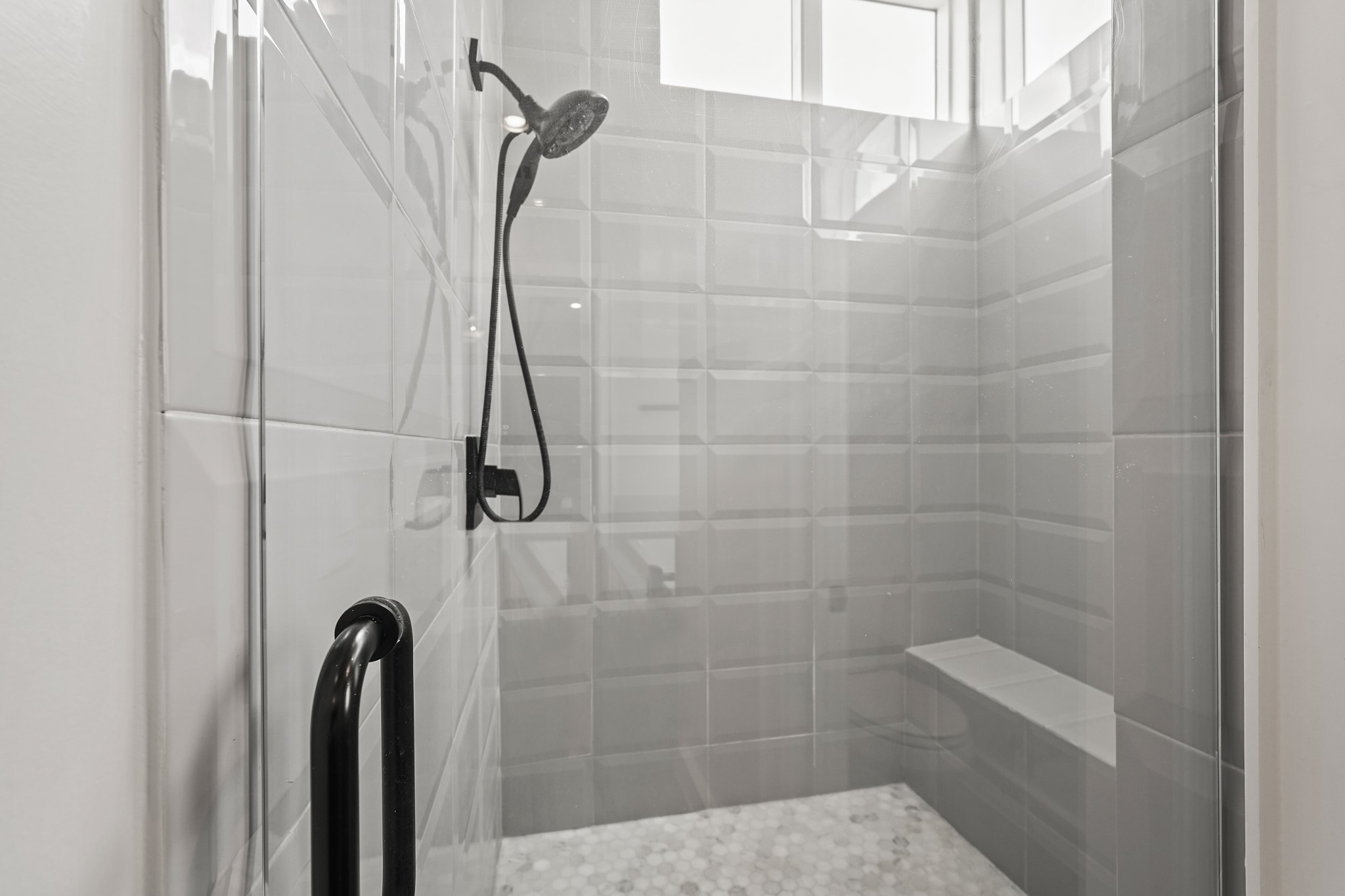 Your Large, Frameless Walk-in Shower Provides Bench Seating for Enhanced Relaxation.