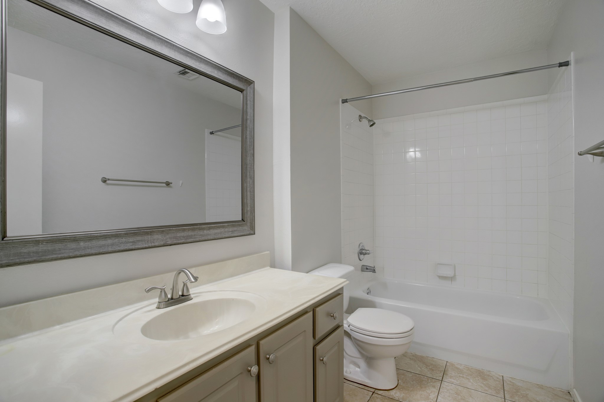 Generous renovated bath with great storage and tub with shower.