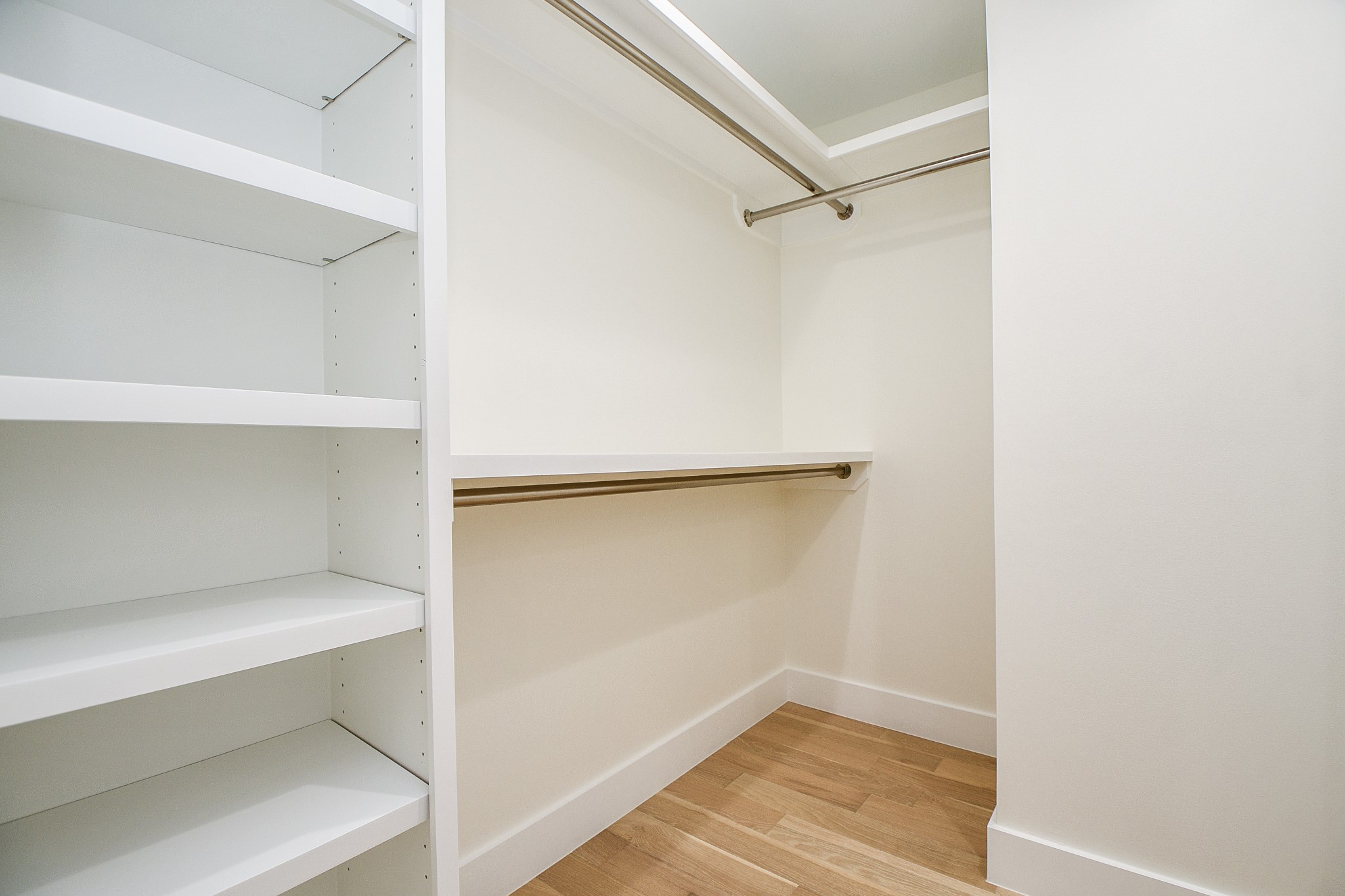 The lush and clever placement of storage and organization options in your primary walk-in closet, can't be beat!