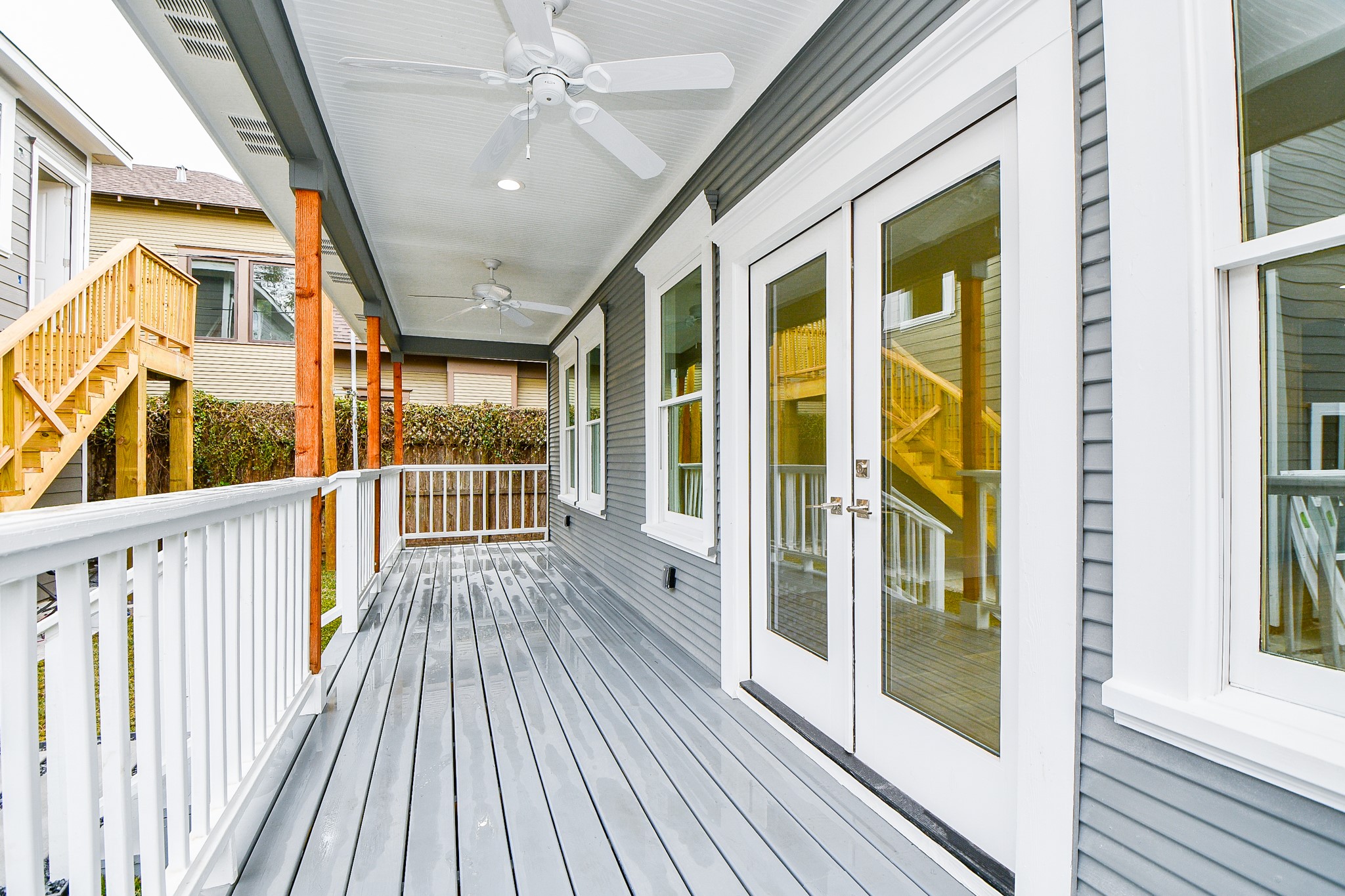This beautiful, wrap-around back porch really embraces an historical throwback!