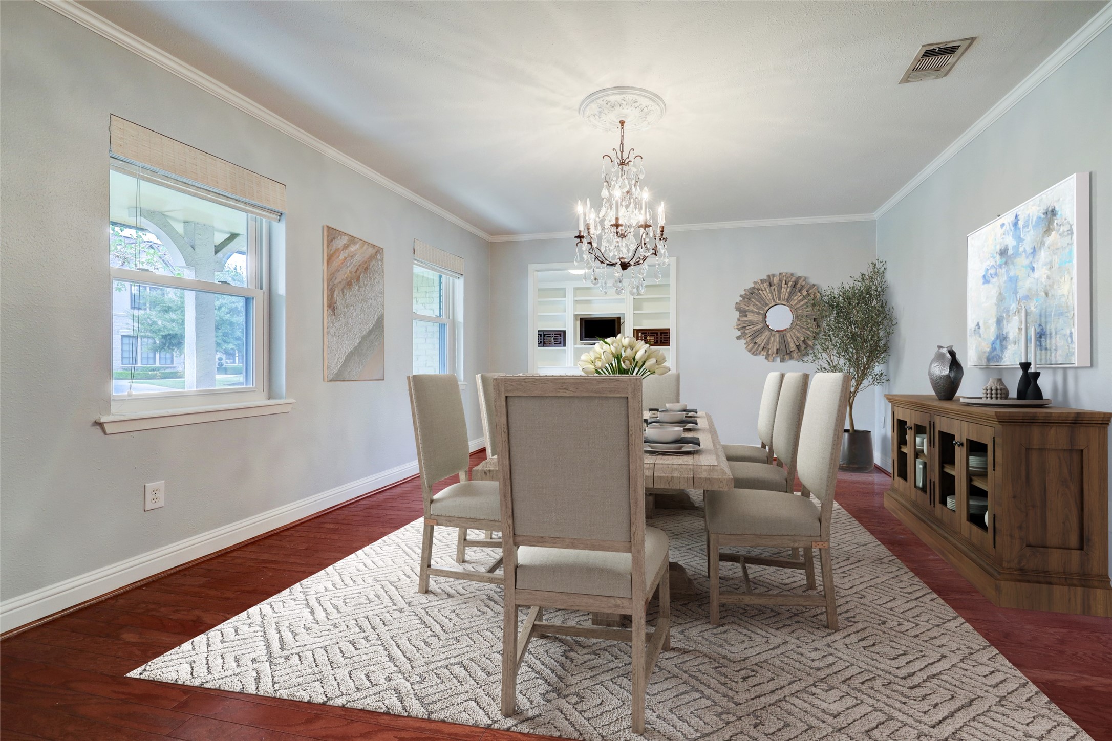 Virtually staged. The spacious dining room, perfect for entertaining, is open to the home office.