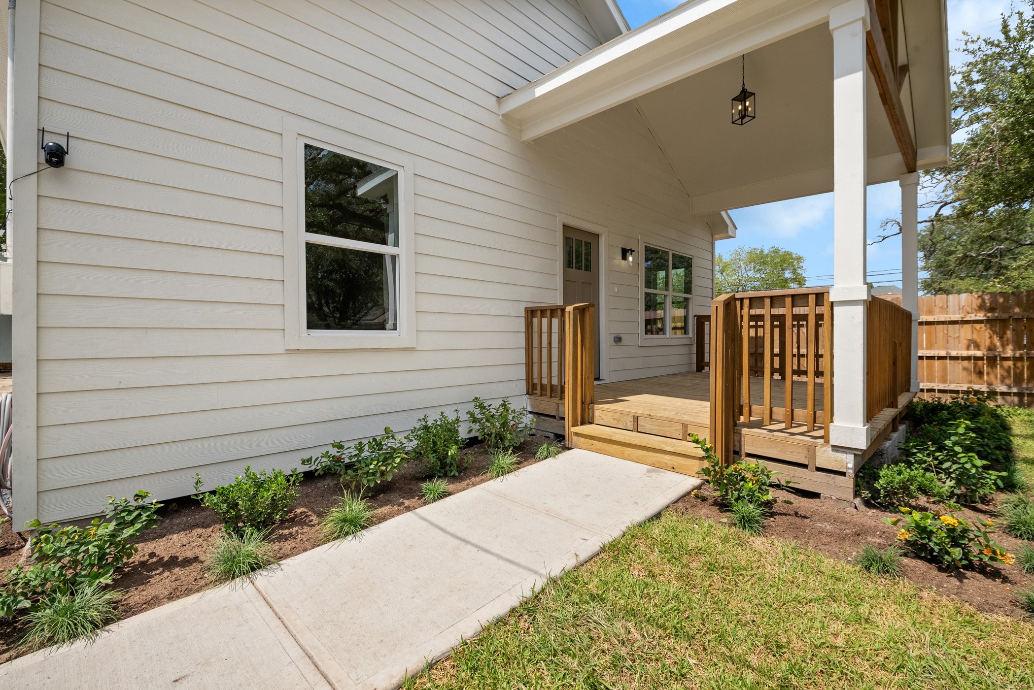 Take a stroll down your private walkway onto this fabulous front porch. What a stunning way to greet people when you have your first holiday party!