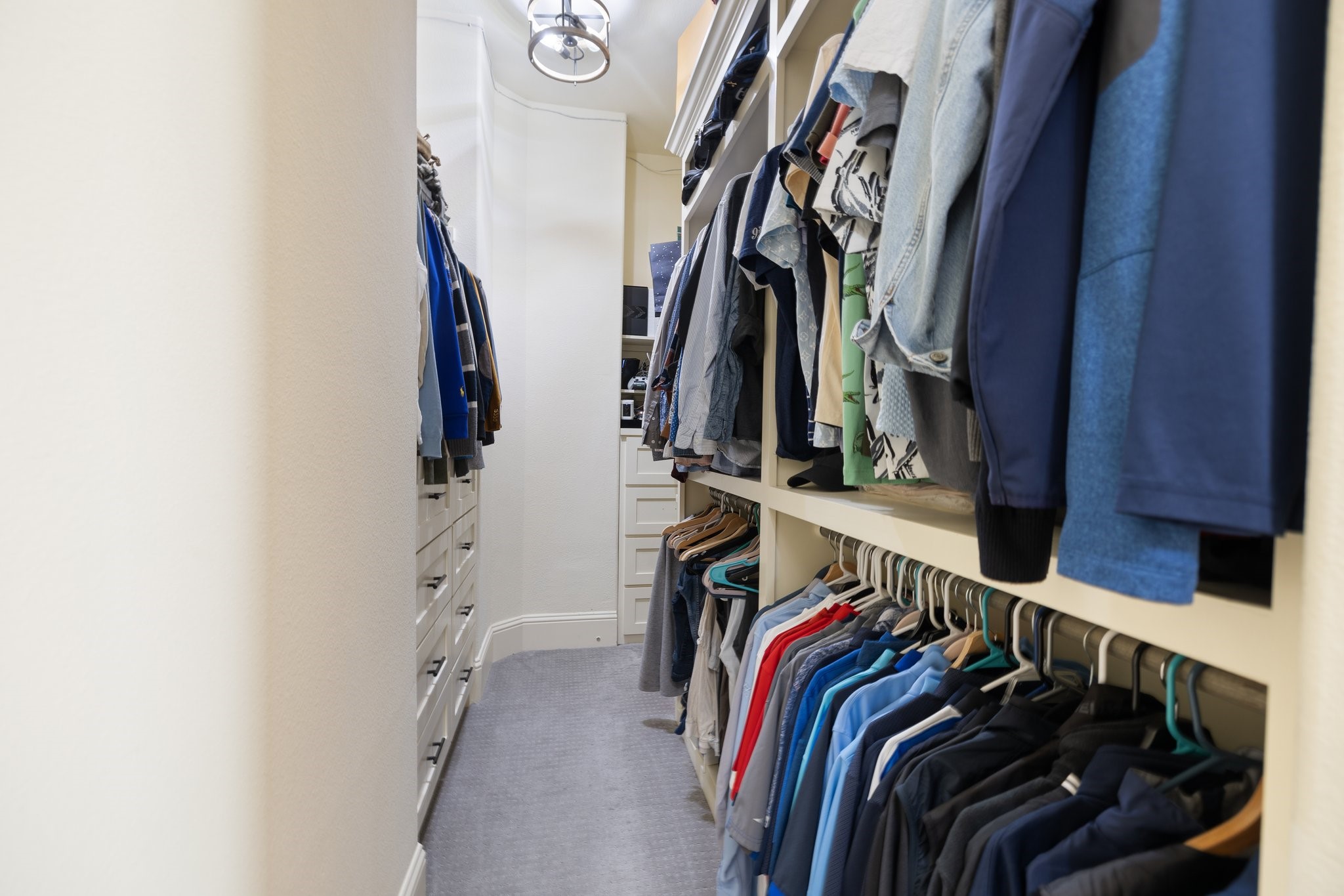The primary closet has been customized to increase functionality and storage!