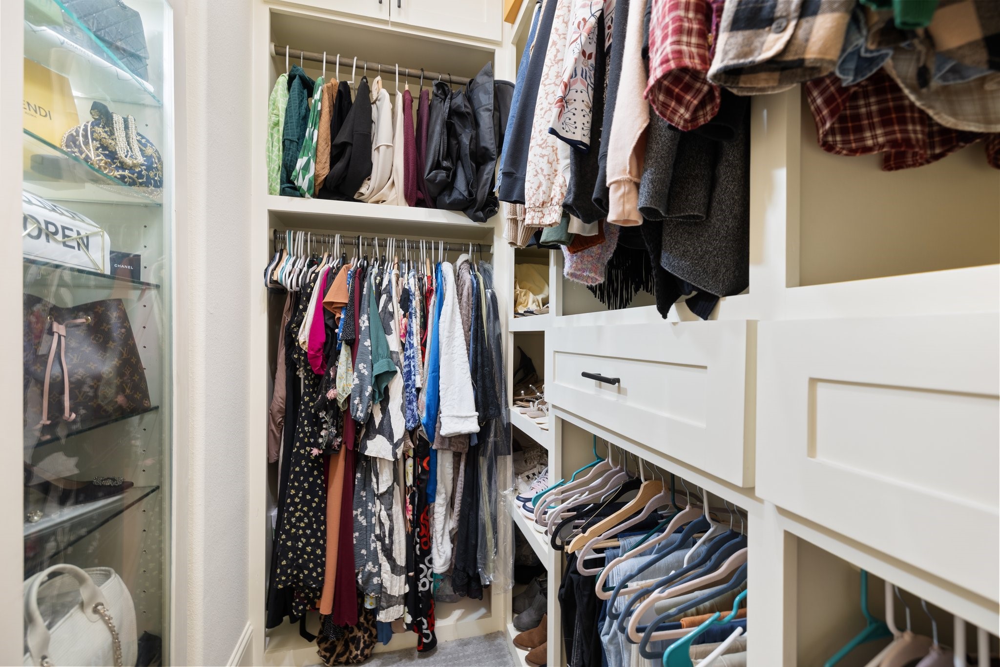 The primary closet has been customized to increase functionality and storage!