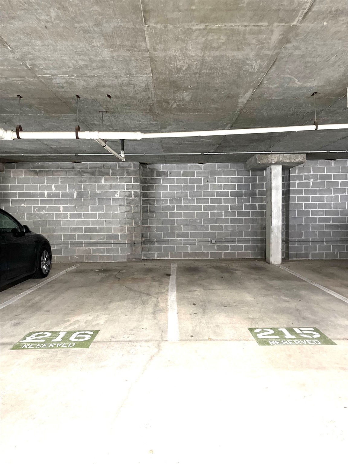 2 parking spots close by an elevator.