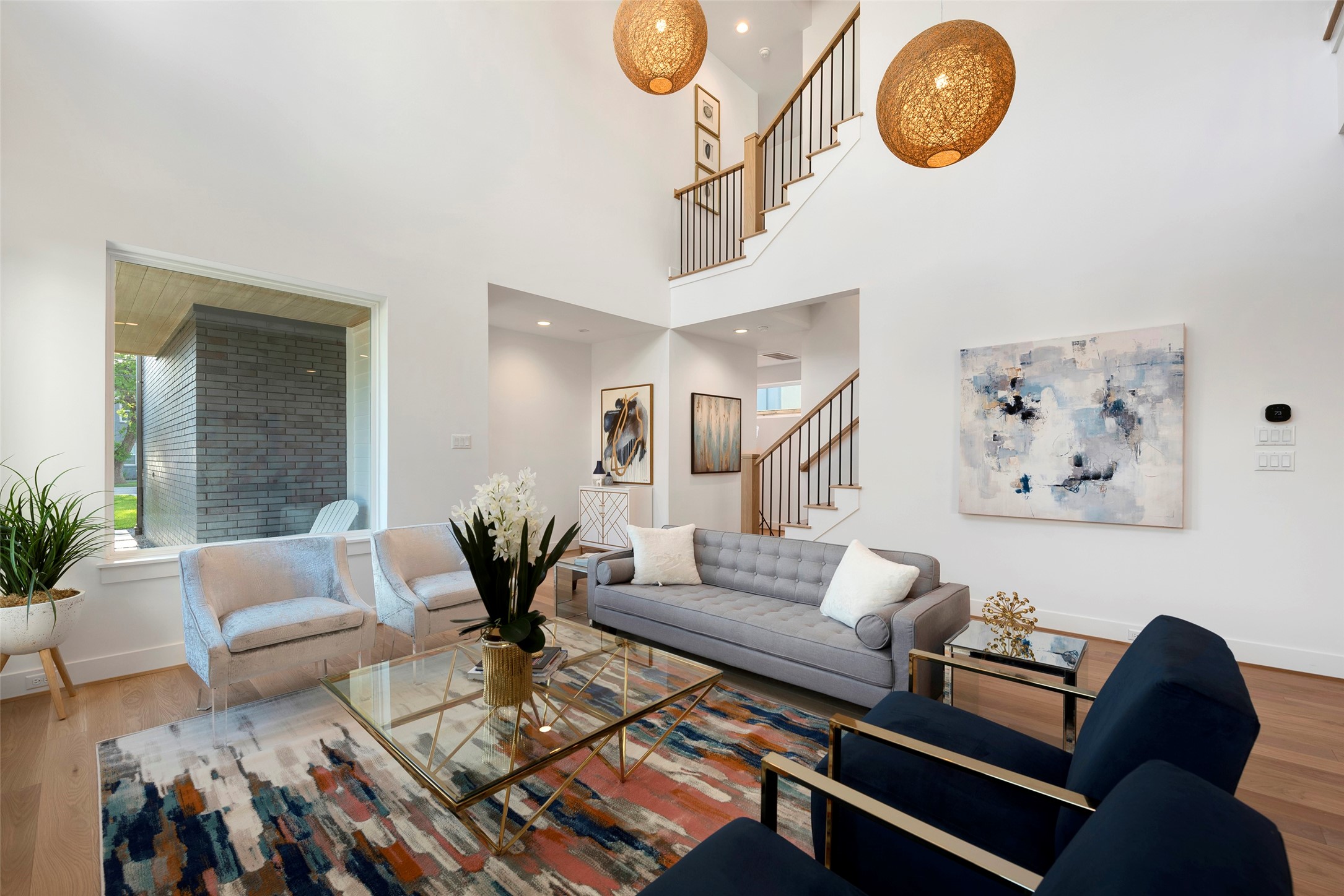 The open concept floor plan offers this beautiful living area with soaring 2-story ceiling.